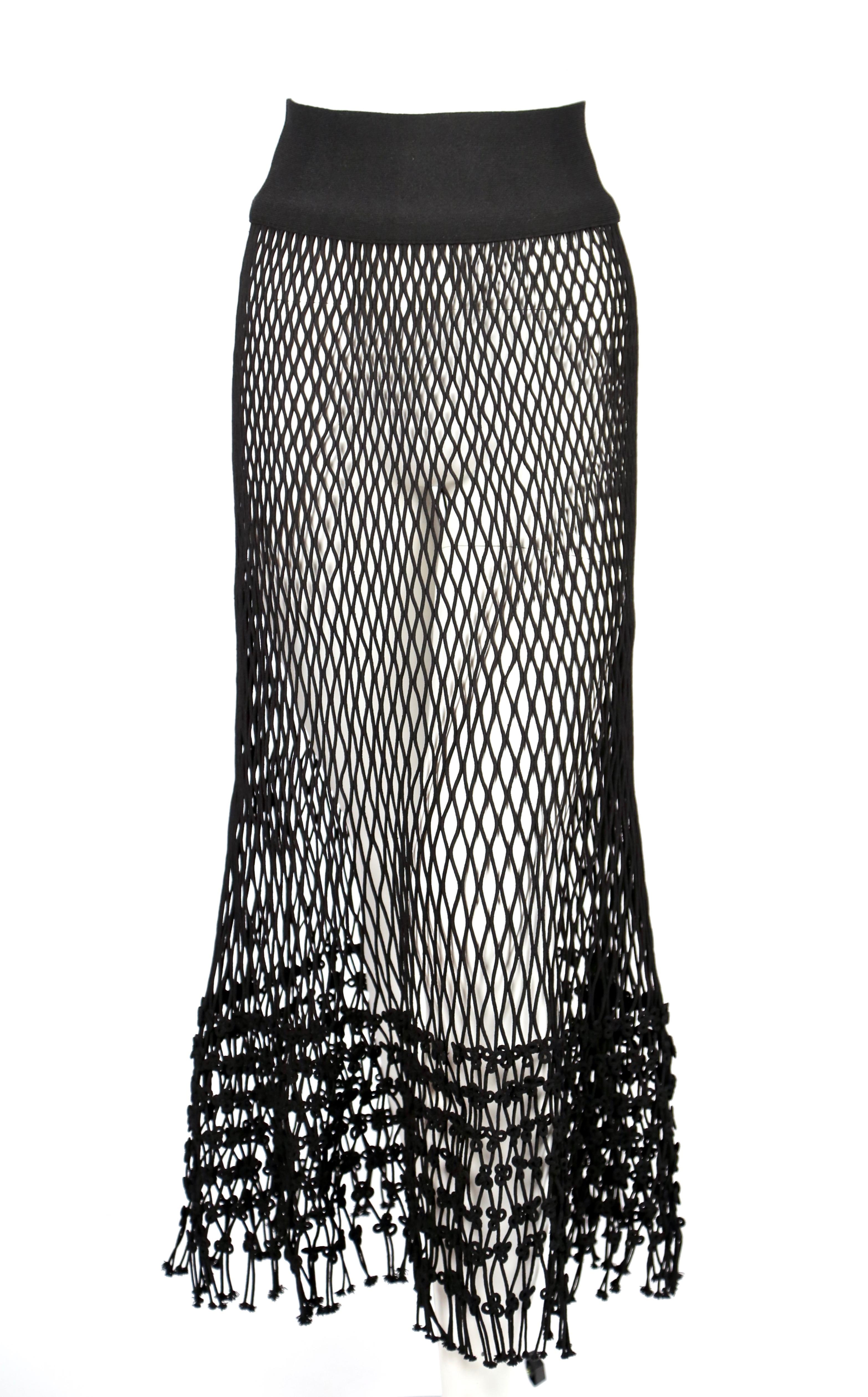 Jet-black, net skirt designed by Phoebe Philo for Celine exactly as seen on the spring 2014 runway and featured in the spring ad campaign. French size S. Approximate measurements (unstretched): waist 26