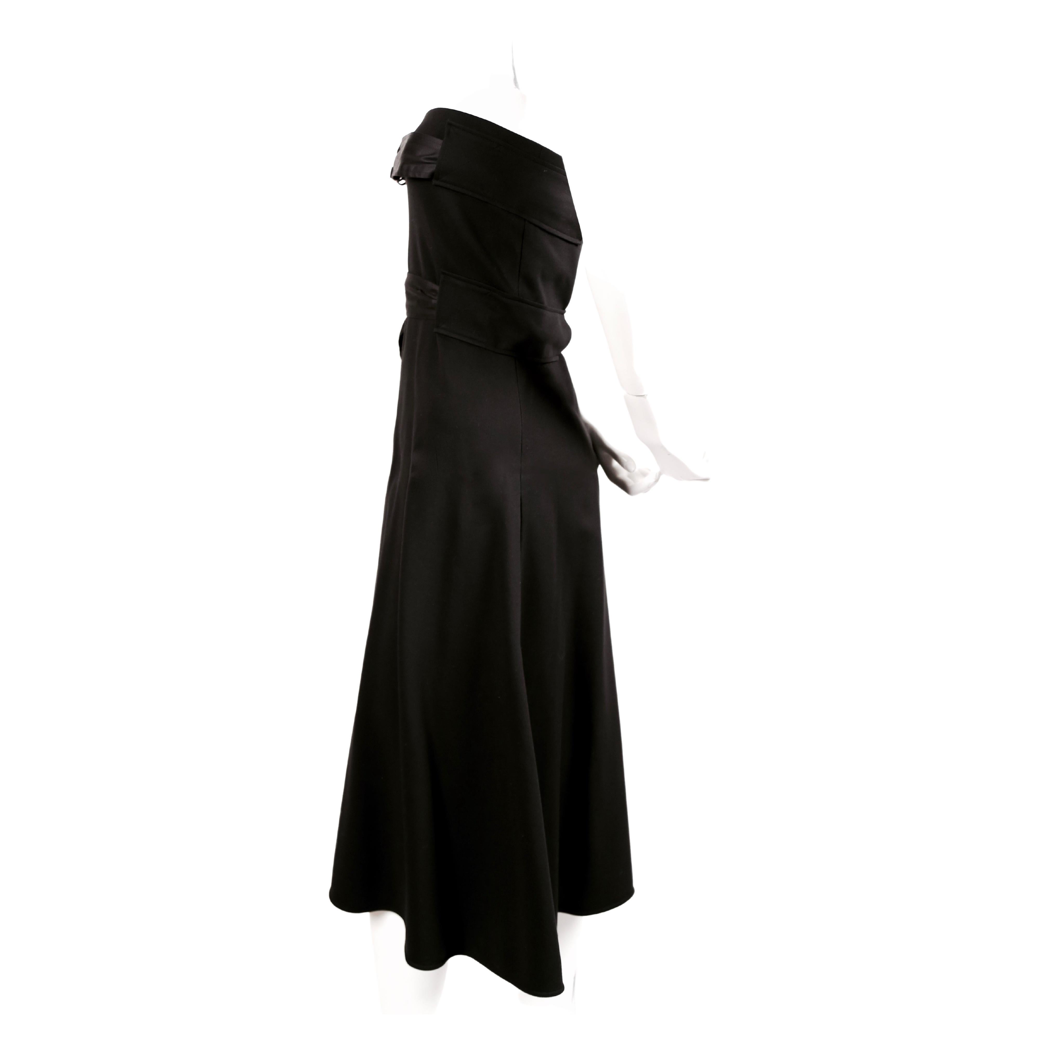 Jet-black, belted, strapless dress with silver hardware designed by Phoebe Philo for Celine dating to resort of 2014. Belts at bust and waist. Can be dressed up or down.  Labeled a French size 36. Approximate measurements: bust 28