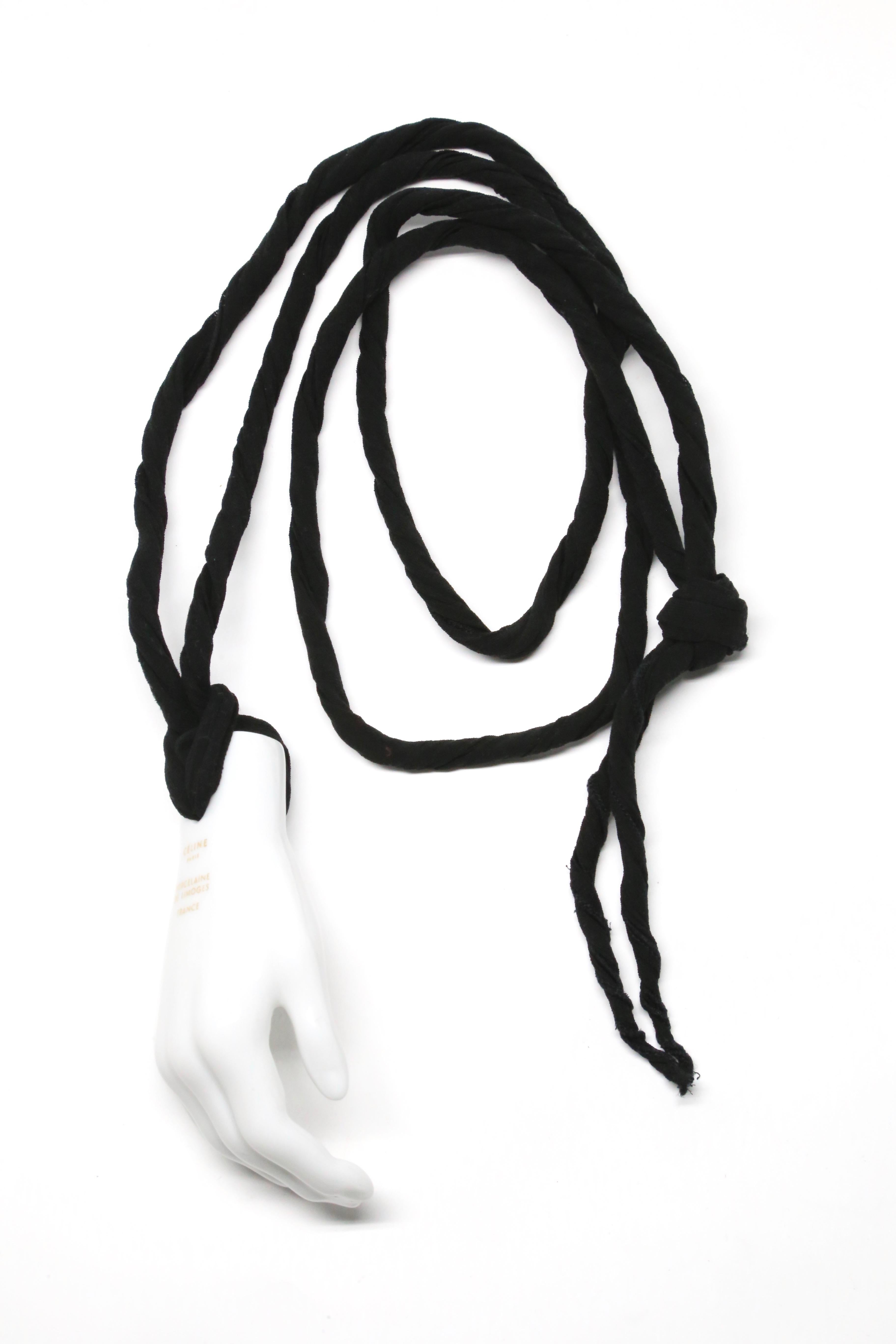 Very rare, white porcelain, surrealist 'hand' pendant necklace on long silk cord designed by Phoebe Philo for Celine exactly as seen on the spring 2014 runway. Manufactured by Porcelaine De Limoges France for Celine. Approximate measurements:
