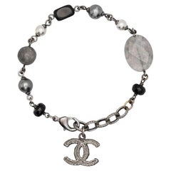 Chanel Crystal and Faux Pearl Paris Souvenirs Charm Bracelet at 1stDibs   chanel pearl charm bracelet, paris charm bracelet, chanel charm bracelets