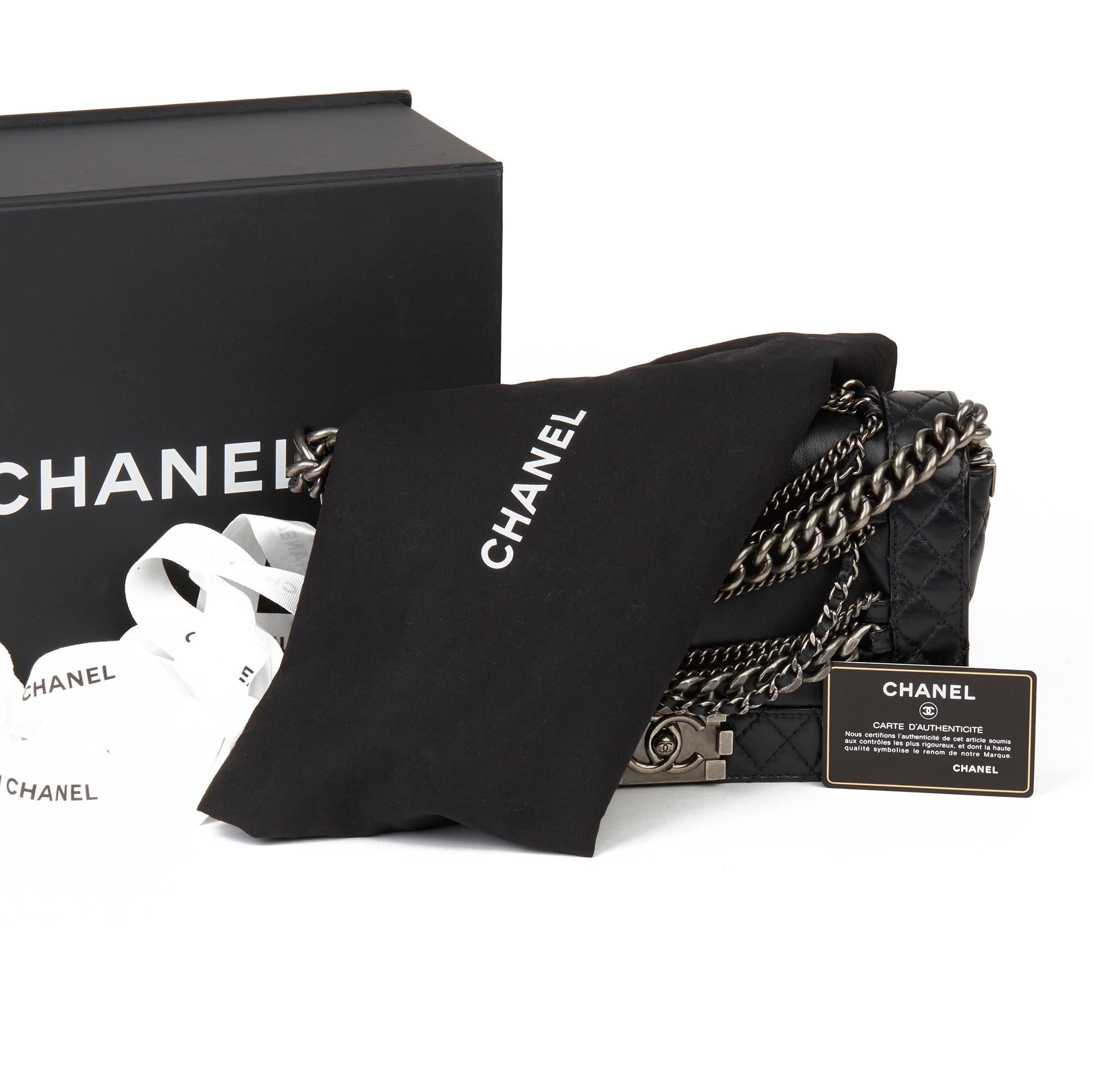 CHANEL
Black Quilted Calfskin Leather Enchained Medium Le Boy Reverso

Xupes Reference: HB3432
Serial Number: 18539774
Age (Circa): 2014
Accompanied By: Chanel Dust Bag, Box, Authenticity Card
Authenticity Details: Authenticity Card, Serial Sticker