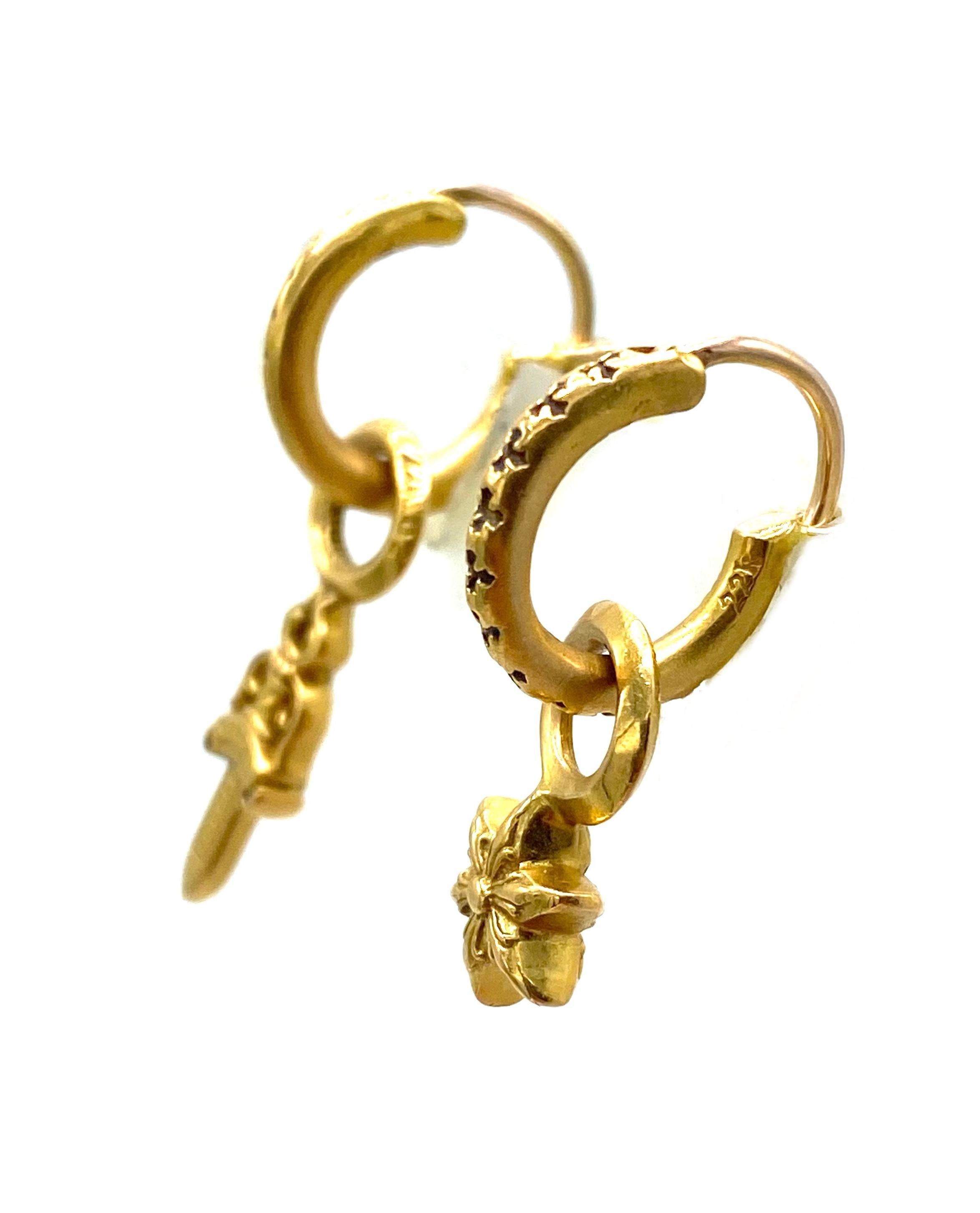 Product details:

The earrings made out of 22 karat yellow gold. it features hoop earrings with the detachable/ interchangeable charm. The earrings are signed by Chrome Hearts, stamped with the date 2014 and 22K.
The knife charm measures 1.25