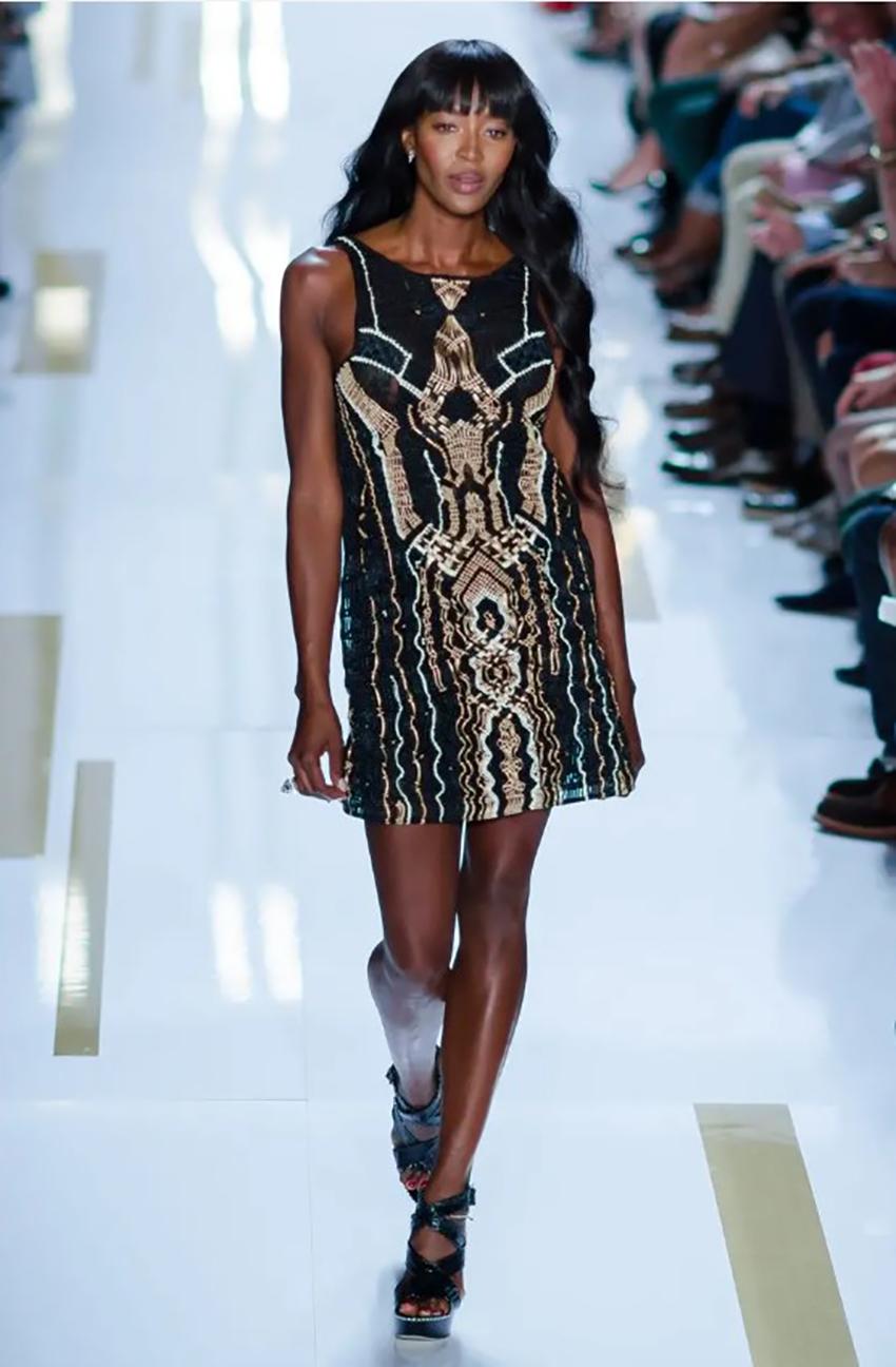 DIANE VON FURSTENBERG 

CROCHET MACRAME Mini DRESS as seen on Naomi
This Napoli dress comes in a metallic shade featuring macramé lace design. The sleeveless dress by Diane Von Furstenberg was launched as a part of the Spring 2014 collection.