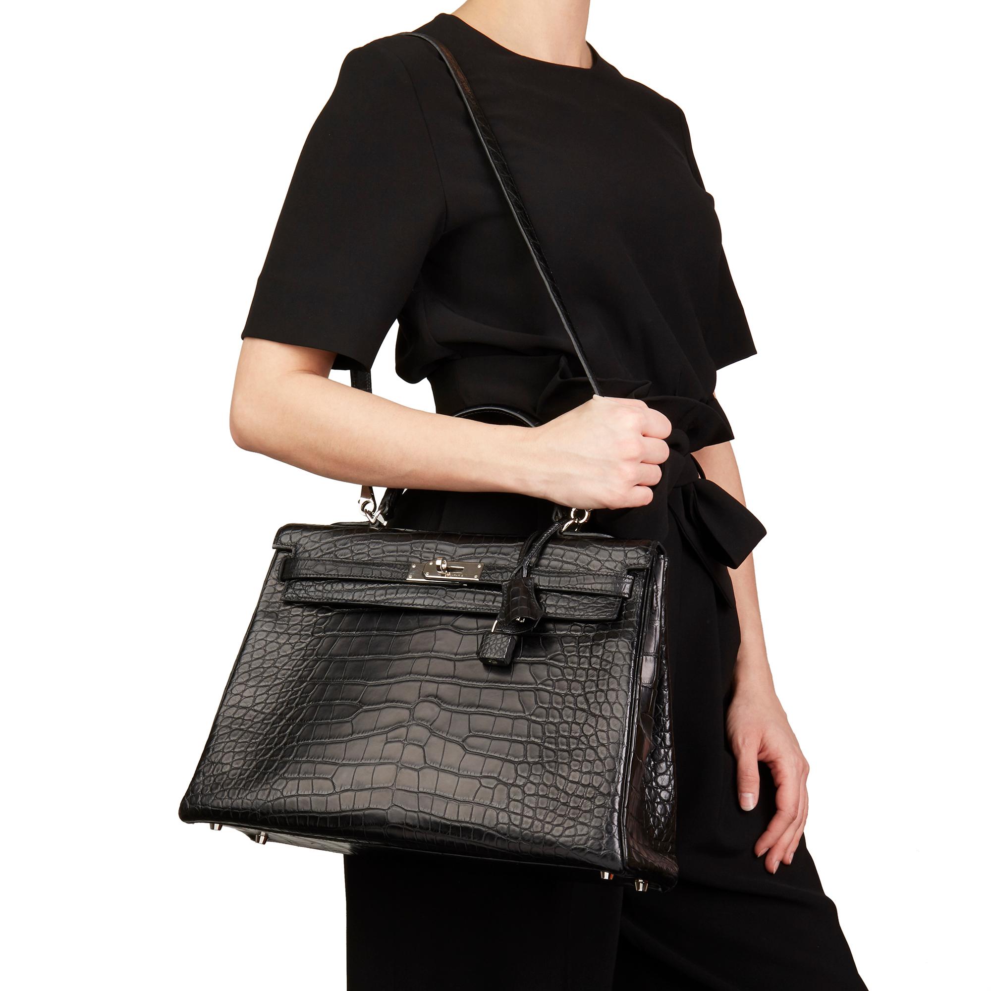 HERMÈS
Black Matte Mississippiensis Alligator Leather Kelly 35cm Retourne

Xupes Reference: HB2522
Serial Number: [R]
Age (Circa): 2014
Accompanied By: Hermès Dust Bag, Lock, Keys, Clochette, Shoulder Strap
Authenticity Details: Date Stamp (Made in
