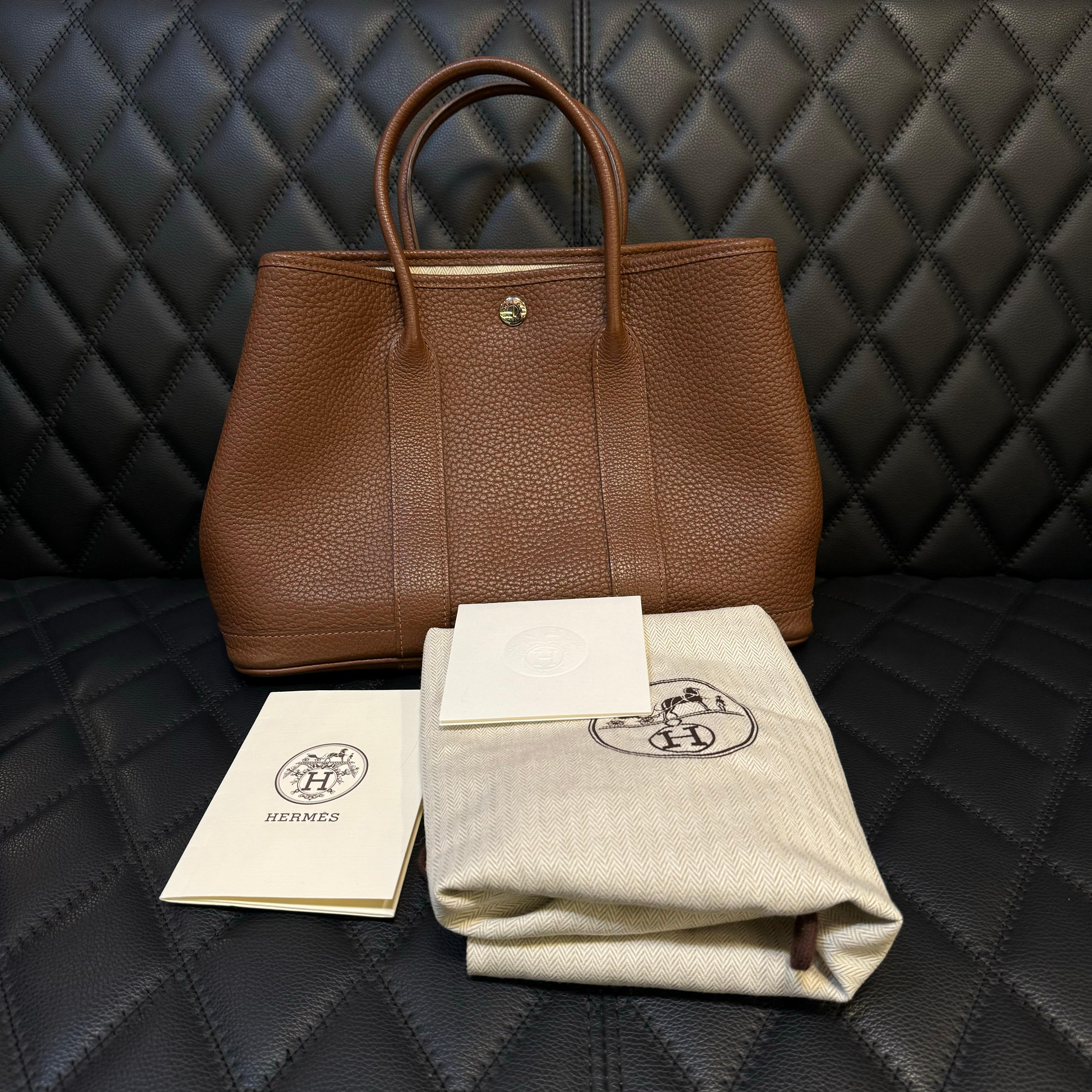 Classic Hermes garden party 30 in marron d’inde negonda leather with palladium hardware. Beautiful neutral color, almost like a darker shade of gold color with a tinge of red clay tone. Overall in very good condition, with slight rubbing and