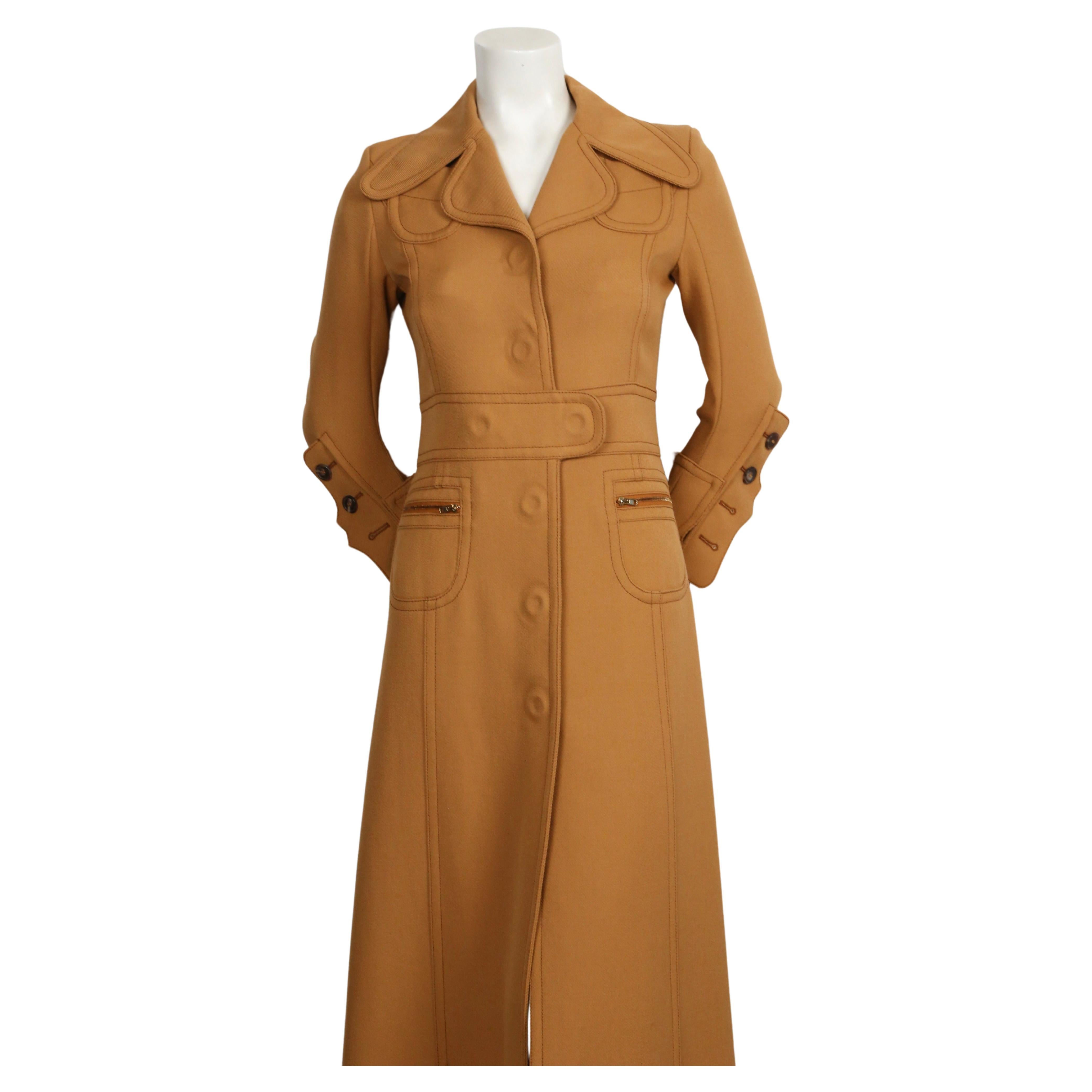 Striking, maxi-length wool gabardine coat with Trompe-l'œil button detail designed by John Galliano for Maison Martin Margiela dating to 2014, exactly as seen on the fall runway.  Labeled a size '40'. Best fits a US size 2 or Italian 38. Approximate