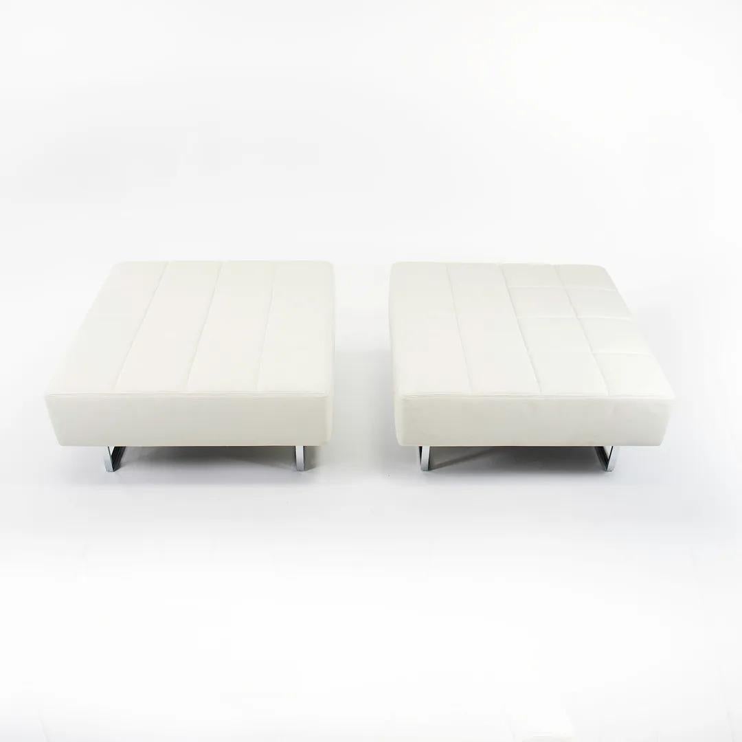 This is a Quadra ottoman, designed in 2001 by Studio Cerri & Associati for Poltrona Frau. Studio Cerri is the collaboration of two dynamo Italian designers, Pierluigi Cerri and Alessandro Colombo. This simple yet überstylish ottoman is outfitted in