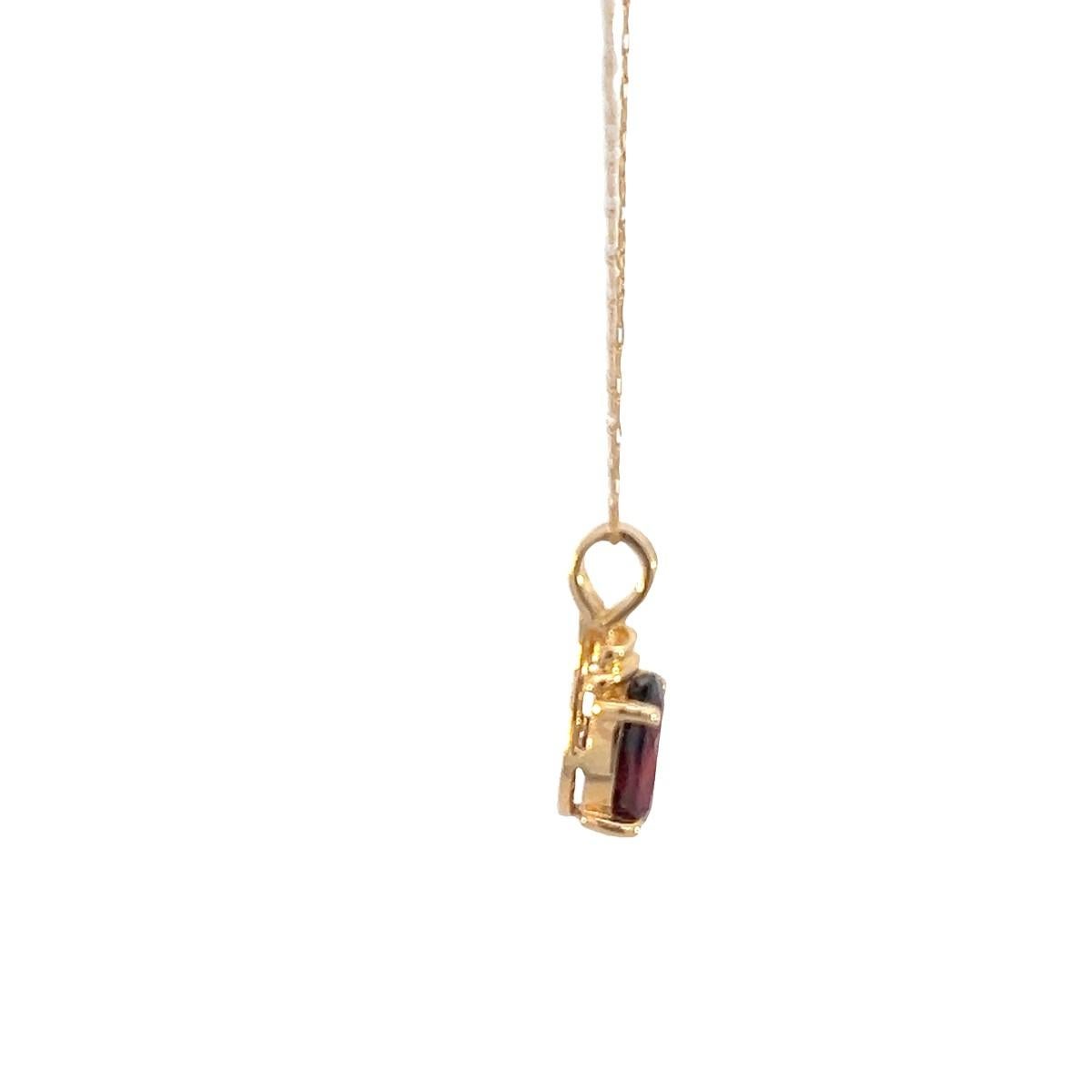 The 20-inch necklace you've described, made of 14K yellow gold and featuring an approximately 2-carat synthetic garnet stone, sounds like a beautiful and eye-catching piece of jewelry. Let's break down some aspects:

Metal Quality: 14K yellow gold