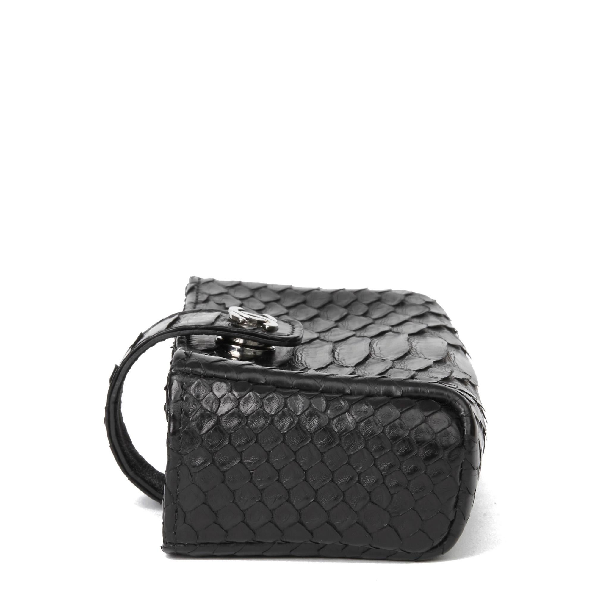 CHANEL
Black Python Leather Pouch-on-Chain POC

Xupes Reference: HB2986
Serial Number: 20556533
Age (Circa): 2015
Accompanied By: Chanel Dust Bag, Box, Authenticity Card, Care Booklet, CITES
Authenticity Details: Serial Sticker, Authenticity Card