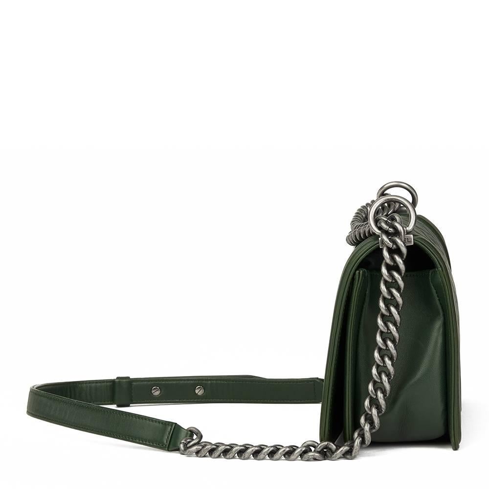 CHANEL
Forest Green Quilted Lambskin Medium Le Boy

This CHANEL Medium Le Boy is in Excellent Pre-Owned Condition accompanied by Chanel Dust Bag, Authenticity Card. Circa 2015. Primarily made from Lambskin Leather complimented by Antiqued Silver