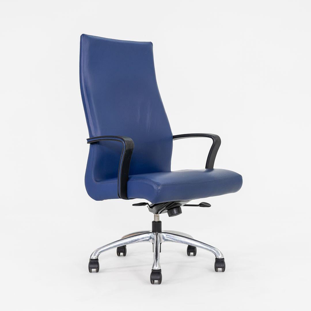 This is a Chord executive high back office chair, originally designed by Michael Shields. This particular example was produced by Coalesse in 2015. The chair is comprised of an aluminum base, resin arm rests, and upholstered in a blue leather. 
 
