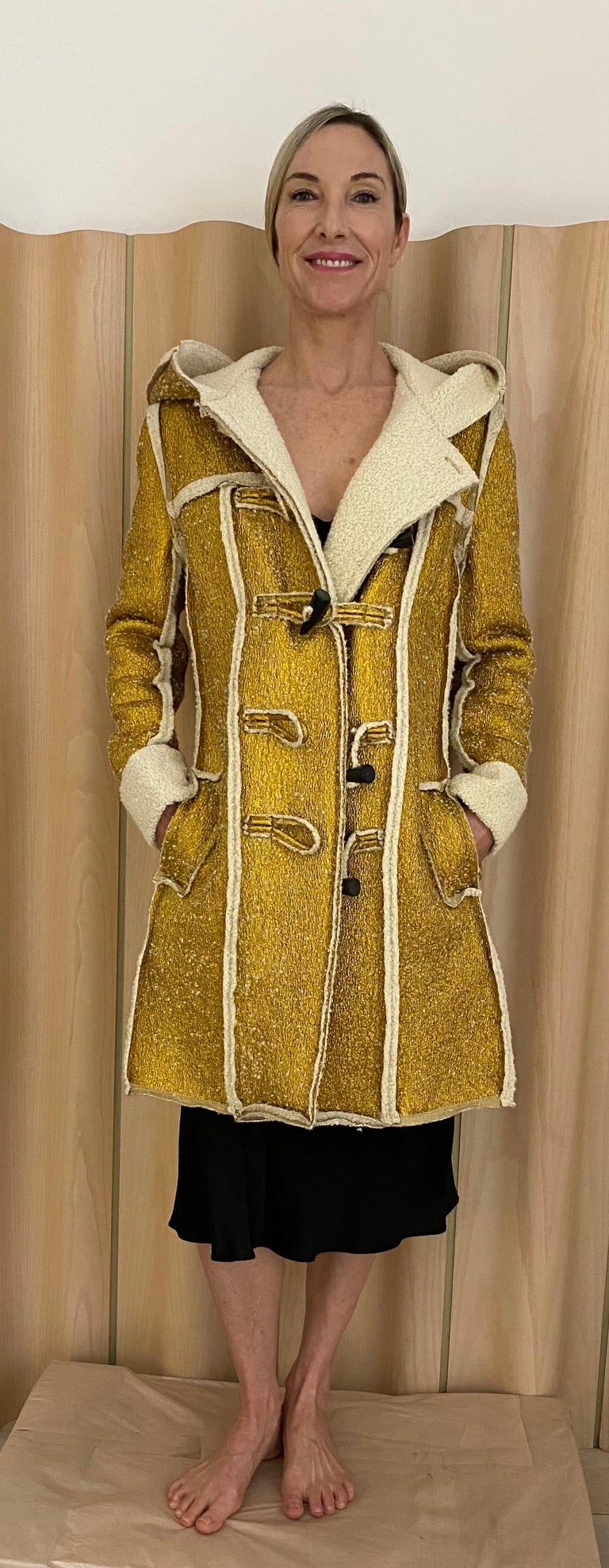 2015 LANVIN Metallic gold pea coat lined in shearling. Toggle buttons. Hooded coat.
coat has pockets. Marked size 40
Measurement: 
Bust : 40” ( buttoned) Hip 40”
Shoulder: 17” flat / Coat lengthen.6”