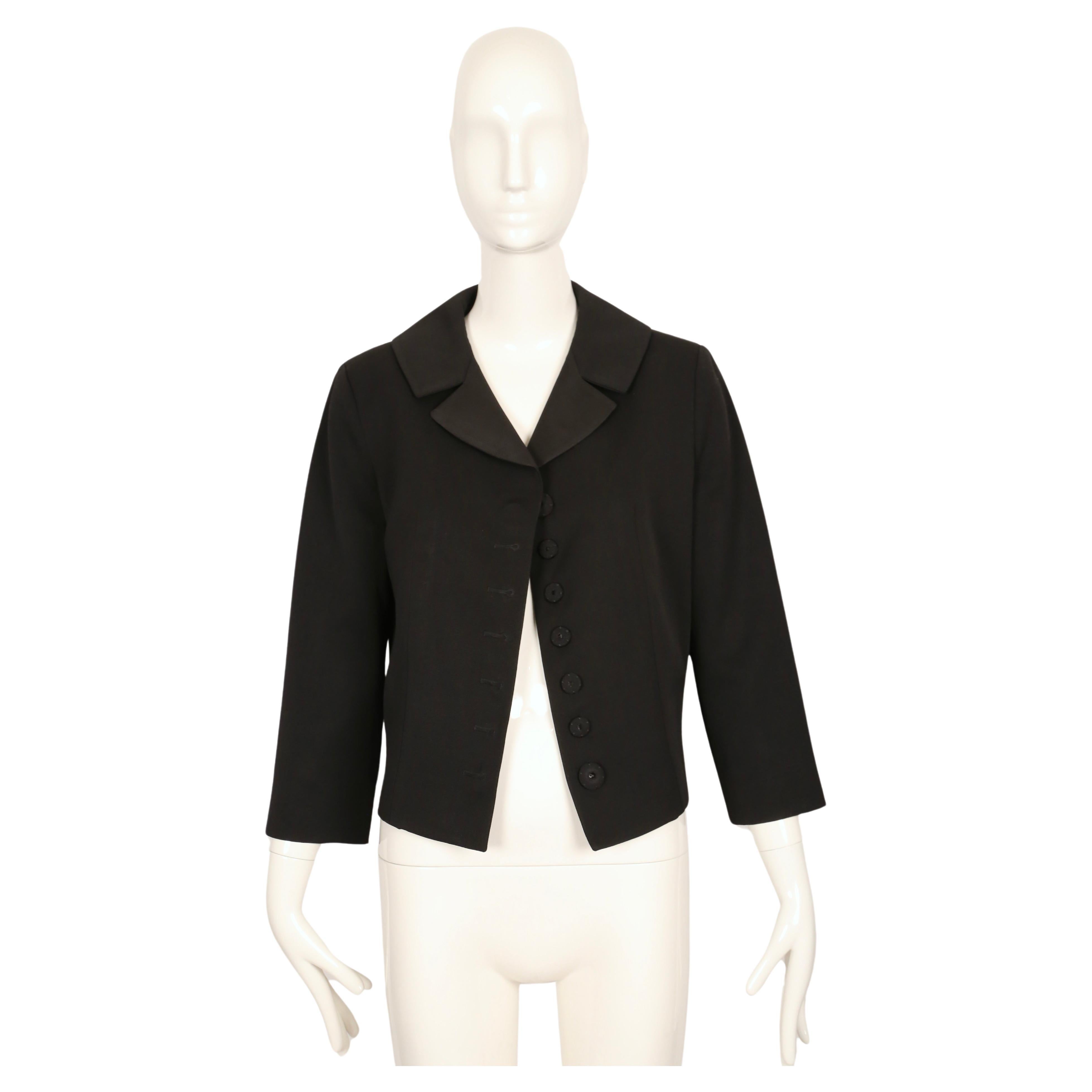 Classic black gabardine jacket with Trompe-l'œil 'button-hole' detail and cropped sleeves designed by John Galliano for Maison Martin Margiela dating to 2015, exactly as seen on the fall runway.  Labeled a size '40'. Best fits a US size 4.