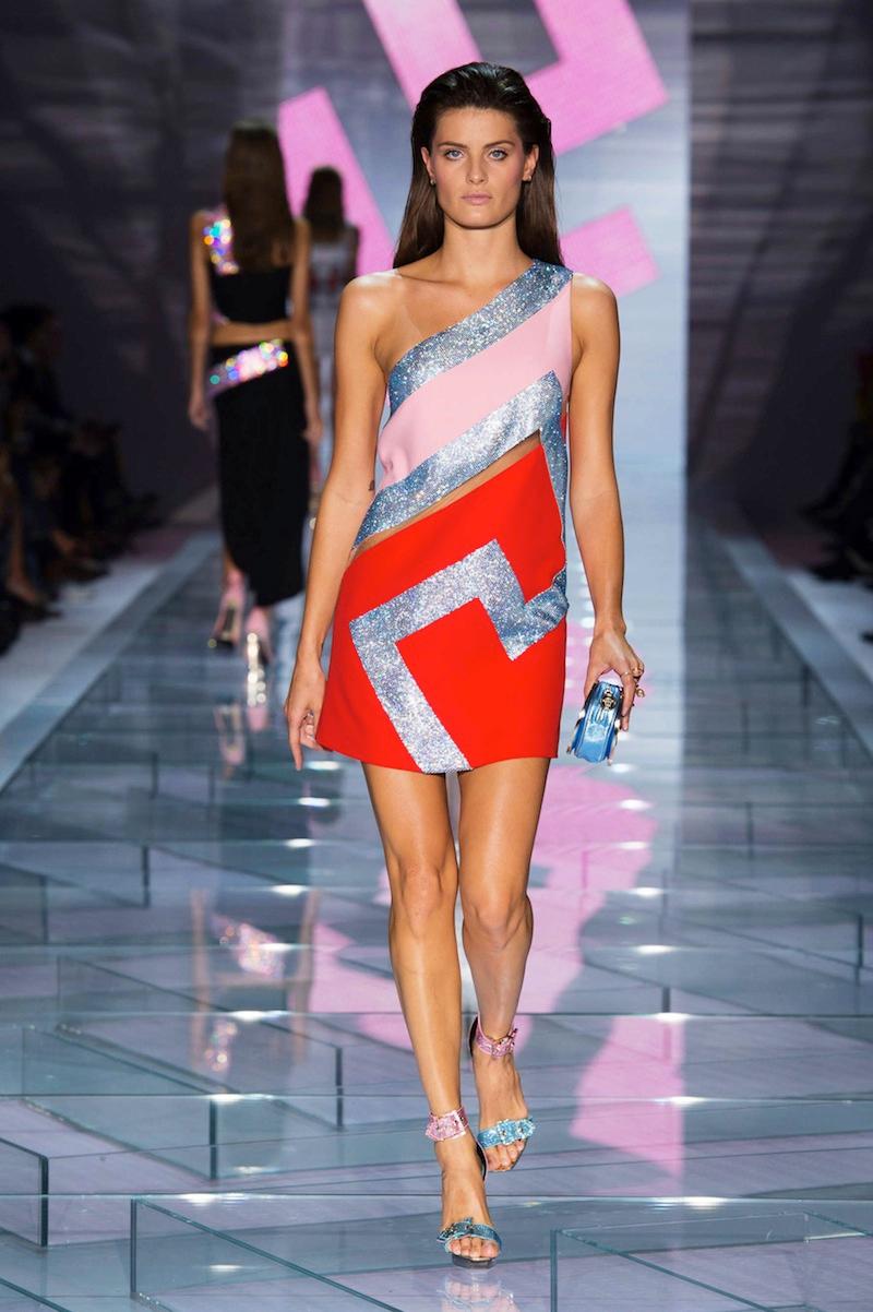 VERSACE 
Actual runway sample Spring/Summer 2015 look # 39
Crystal embellished dress
Versace's mini dress sings high-octane glamour. 
It has straight silhouette with a sheer mesh tulle panel and Swarovski crystal embellishment.
Fully lined
Hidden