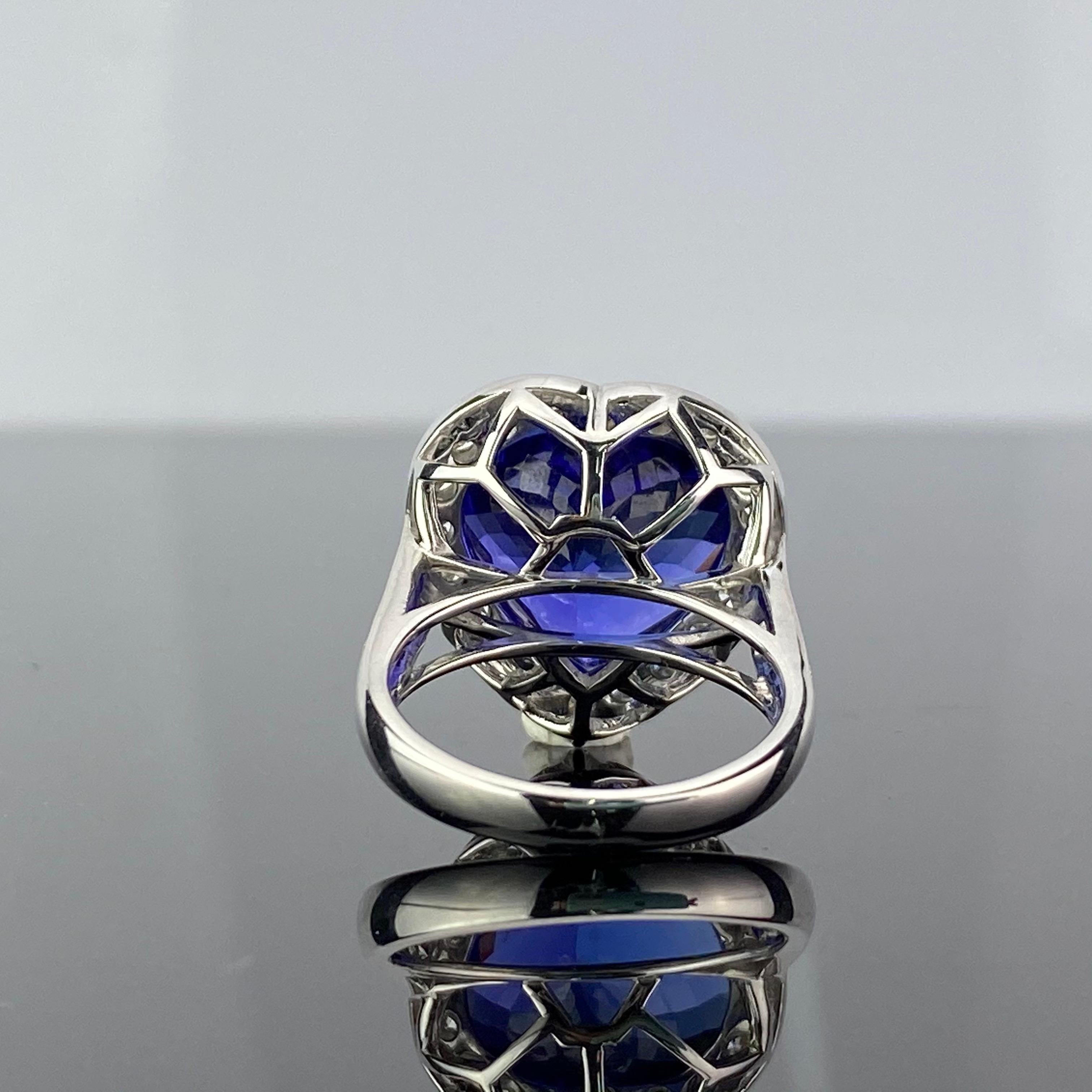 A beautiful 20.16 carat heart-shape Tanzanite engagement cocktail ring, with 1.26 carats of VS quality White Diamonds. The Tanzanite is absolutely transparent with no inclusions and a stunning royal blue color. The gemstones are set in 10.09 grams