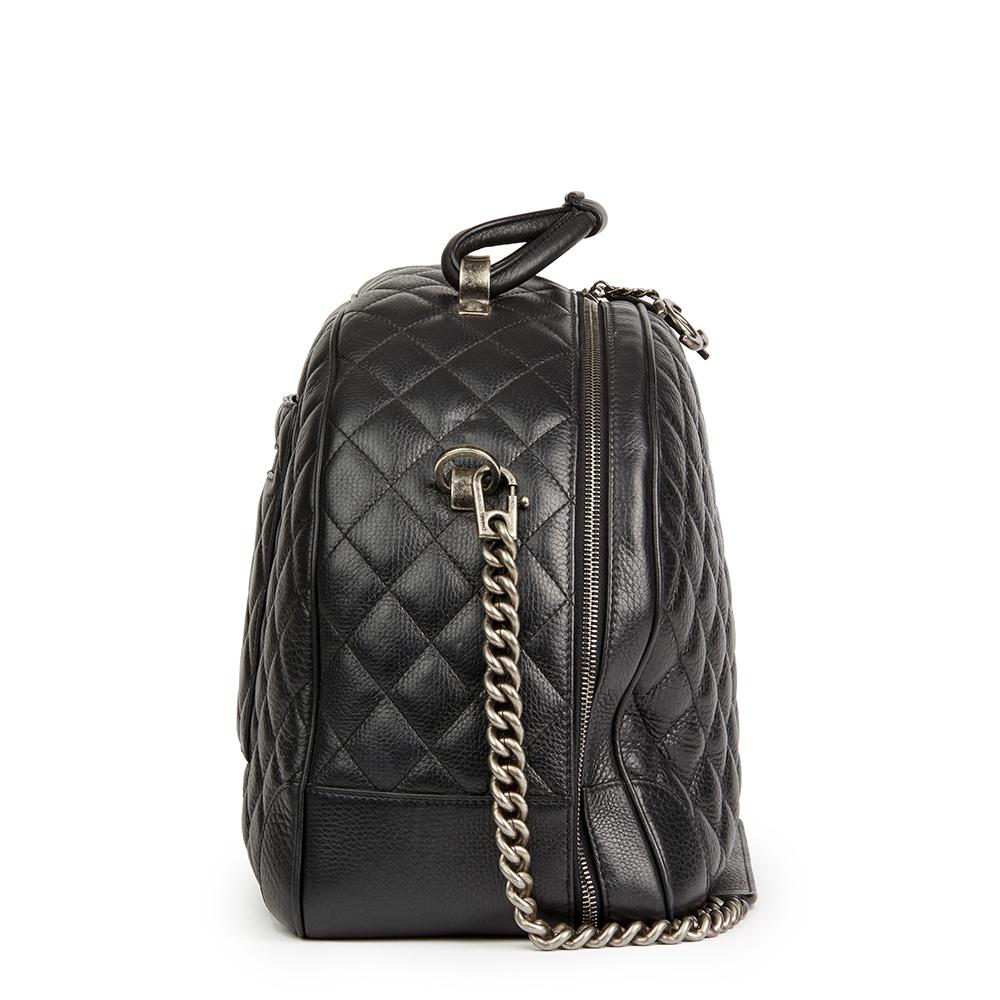CHANEL
Black Quilted Calfskin Large Round Trip Bowling Bag

Reference: HB2147
Serial Number: 22283914
Age (Circa): 2016
Accompanied By: Authenticity Card, Care Booklet
Authenticity Details: Authenticity Card, Serial Sticker (Made in Italy)
Gender: