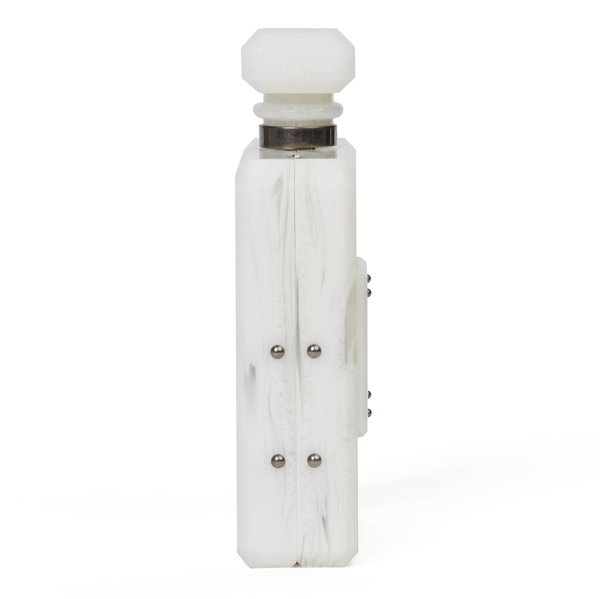 CHANEL
White Marble Plexiglass Paris-Rome Perfume Bottle Bag

Serial Number: 23076004
Age (Circa): 2016
Accompanied By: Chanel Dust Bag, Box, Authenticity Card,
Authenticity Details: Serial Sticker, Authenticity Card (Made in France)
Gender: