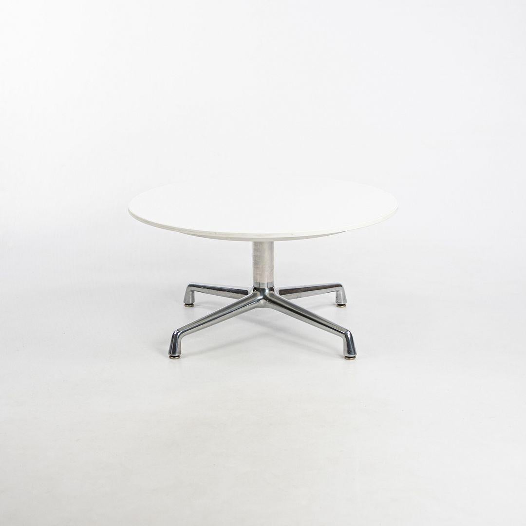 This is a SW_1 Occasional Table, originally designed by Scott Wilson. This particular example was produced by Coalesse in 2017 in the USA. It's comprised of a white laminate tabletop atop an aluminum base. 

The listed price includes one table and