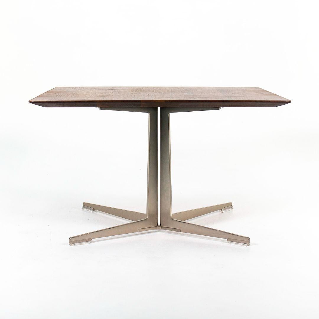 This is a ‚ÄúFly‚Äù rectangular side table, designed by Antonio Citterio for Flexform in 2009. This particular example was produced in Italy in 2016. The table is constructed of a satin stainless-steel base, and has a solid Canaletto walnut top with