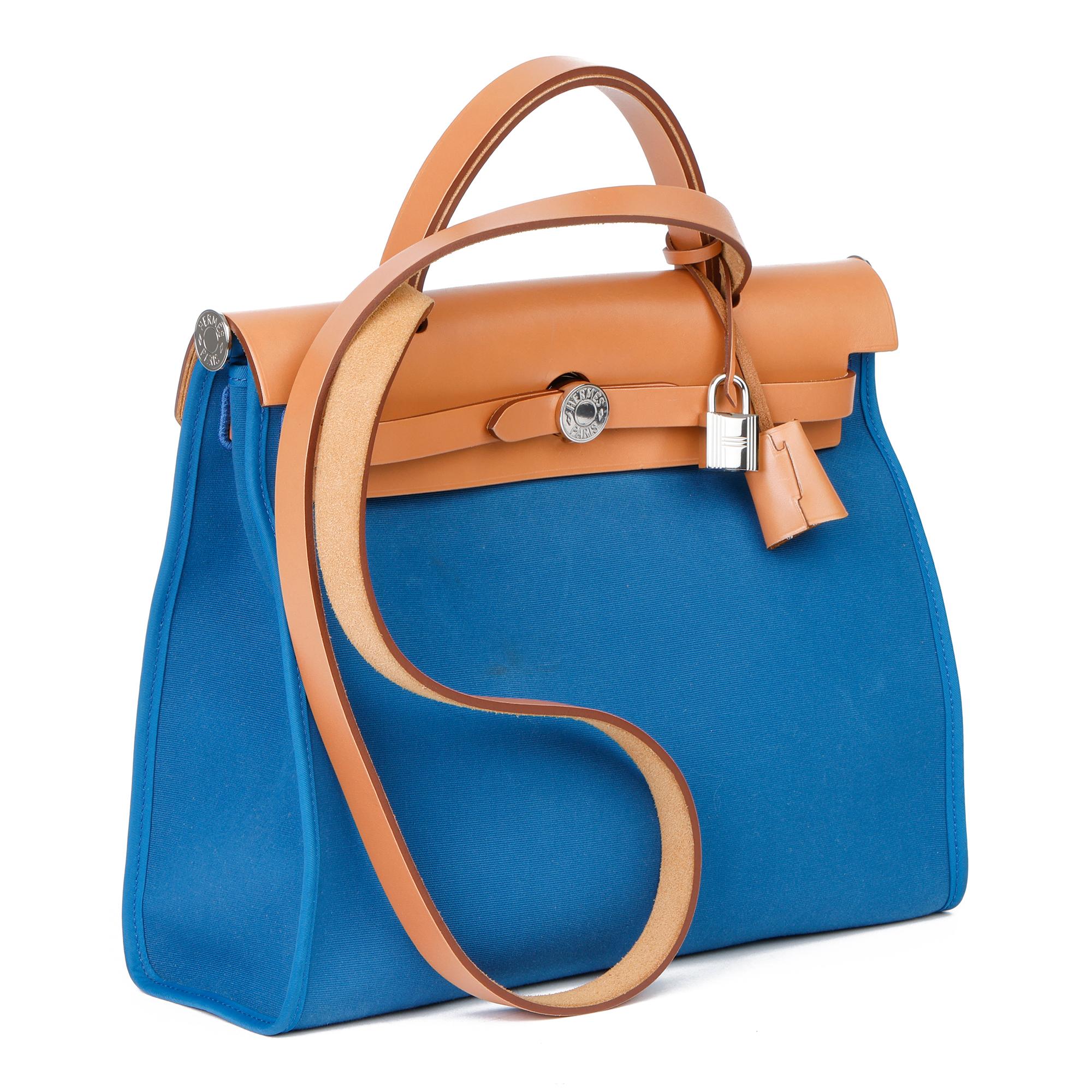 HERMÈS
Natural Vache Hunter Cowhide Leather & Blue Ocean Canvas Herbag Zip 31

Xupes Reference: CB354
Serial Number: X
Age (Circa): 2016
Accompanied By: Hermès Box, Dust Bag, Lock, Keys, Clochette, Interior Pouch
Authenticity Details: Date Stamp