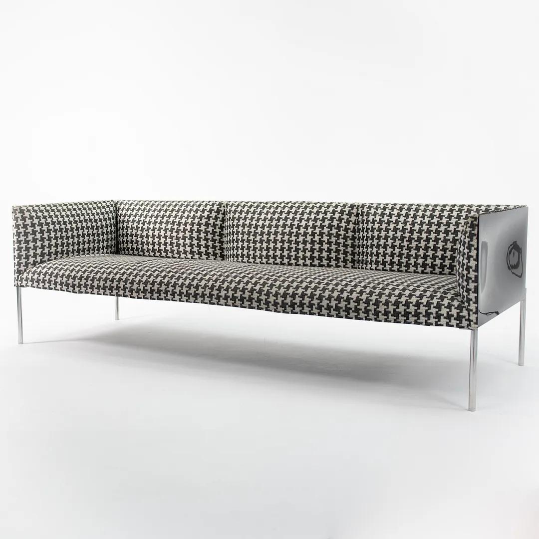 This is a ‘Hollow’ Case Sofa, designed by Patricia Urquiola for B & B Italia in 2006. This particular piece was manufactured in Italy in 2016. The design features upholstered interior panels done in a black and white houndstooth fabric, while the