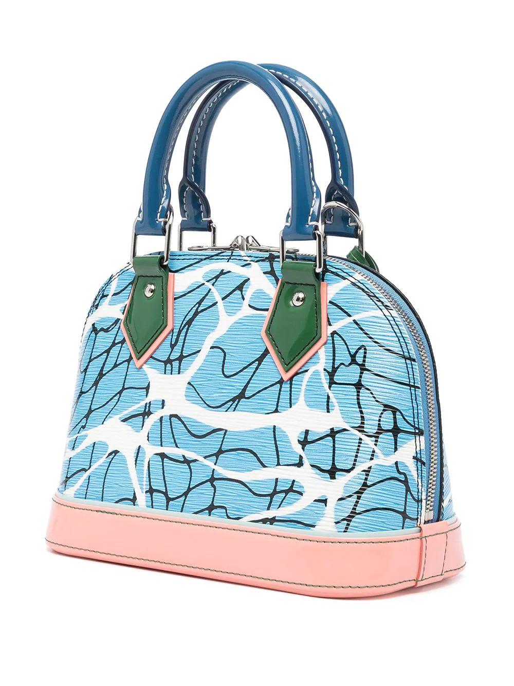 Inspired by California and its crystal blue water pools, this limited-edition pre-owned Louis Vuitton Alma bag from the 2016 Cruise runway collection has been crafted in reviving shades of blue, white, and green. Finished with a pastel pink base and