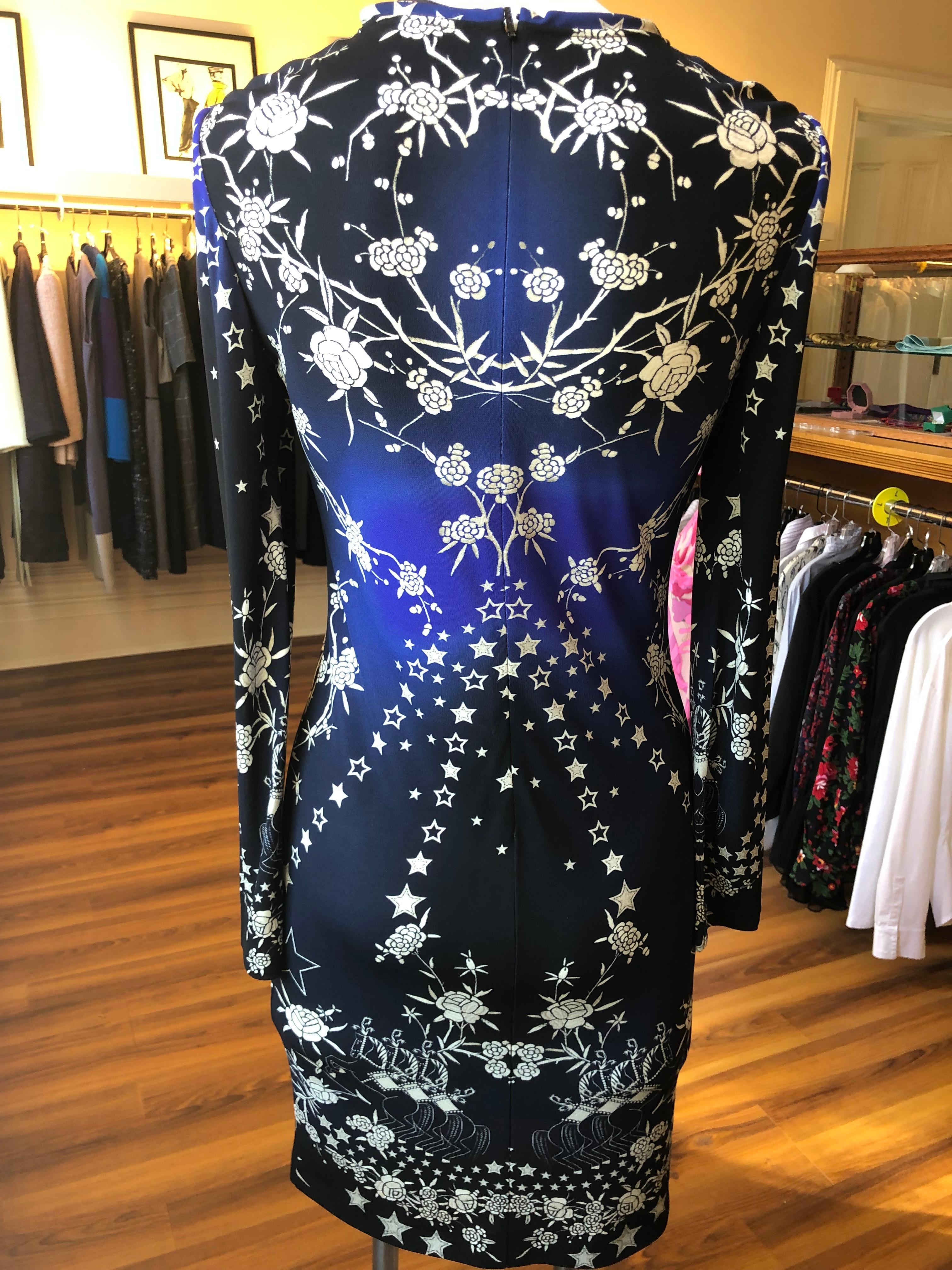This is a Roberto Cavalli long sleeved blue ombre viscose jersey dress, with a crew neckline. The dress is floral and star printed with bonus horse print at the bottom.

This dress is very comfortable and easy to travel with.
