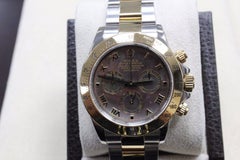 2016 Rolex Daytona 116523 18 Karat Gold and Stainless Black Mother-of-Pearl Dial