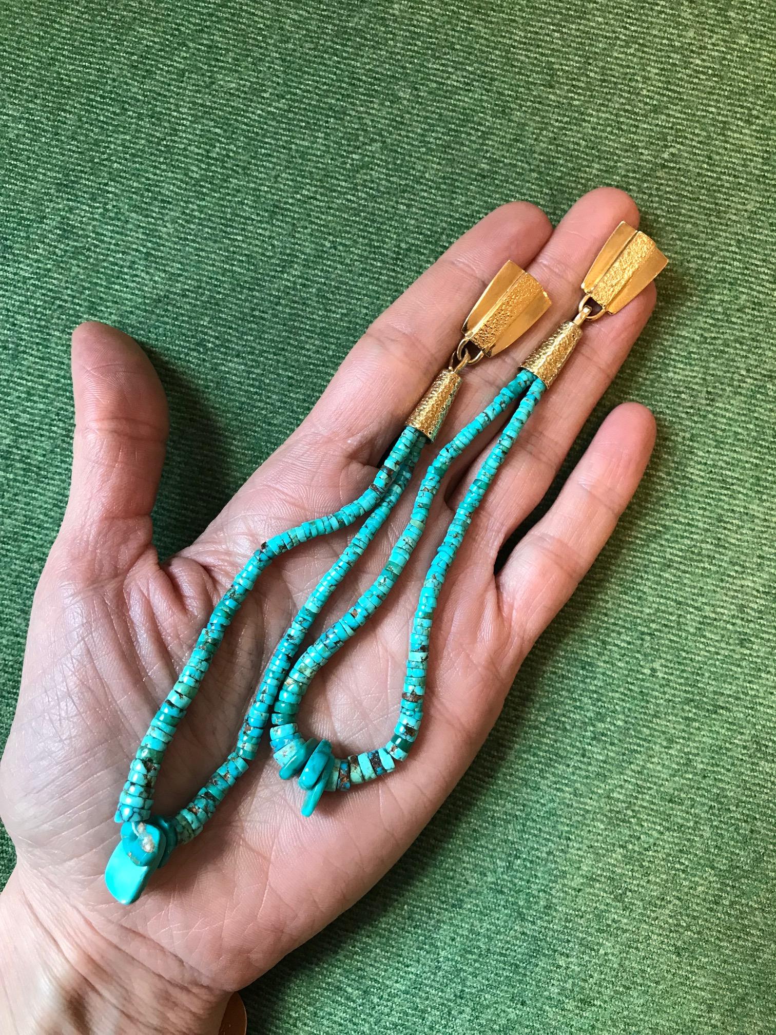 A pair of fine turquoise heishi bead jacla and 18 karat gold earrings, by Verma Nequatewa (Sonwai), 2016

The earrings are stamped 18K, Sonwai.

Sonwai is the niece and acknowledged protege of major modernist jeweler, Charles Loloma. In 2018, the