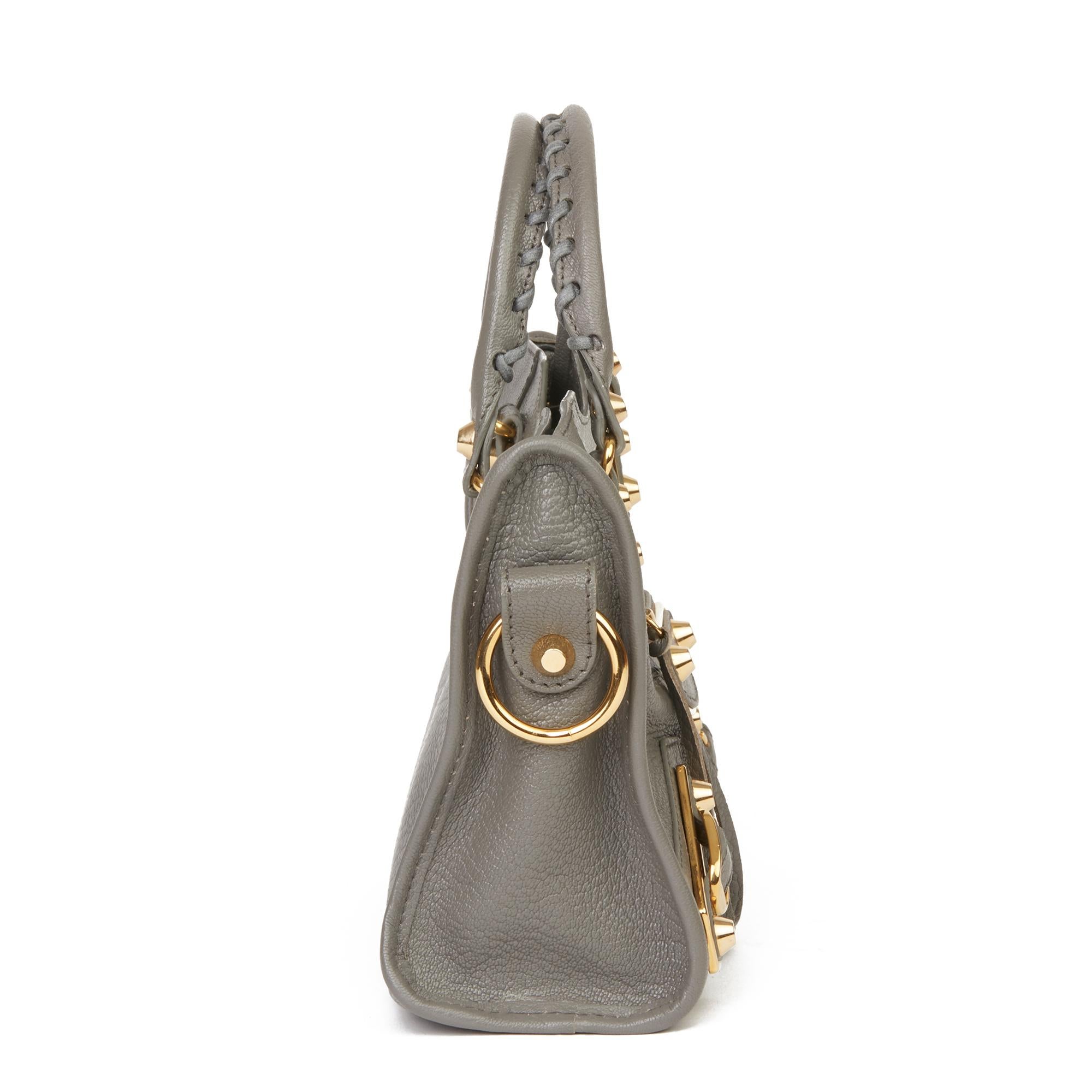 BALENCIAGA
Gris Acier Chevre Goatskin Leather Mini City

Xupes Reference: HB3080
Serial Number: 3901601320-B-528147
Age (Circa): 2017
Accompanied By: Balenciaga Dust Bag, Care Booklet, Tag, Leather Swatch, Shoulder Strap
Authenticity Details: Date
