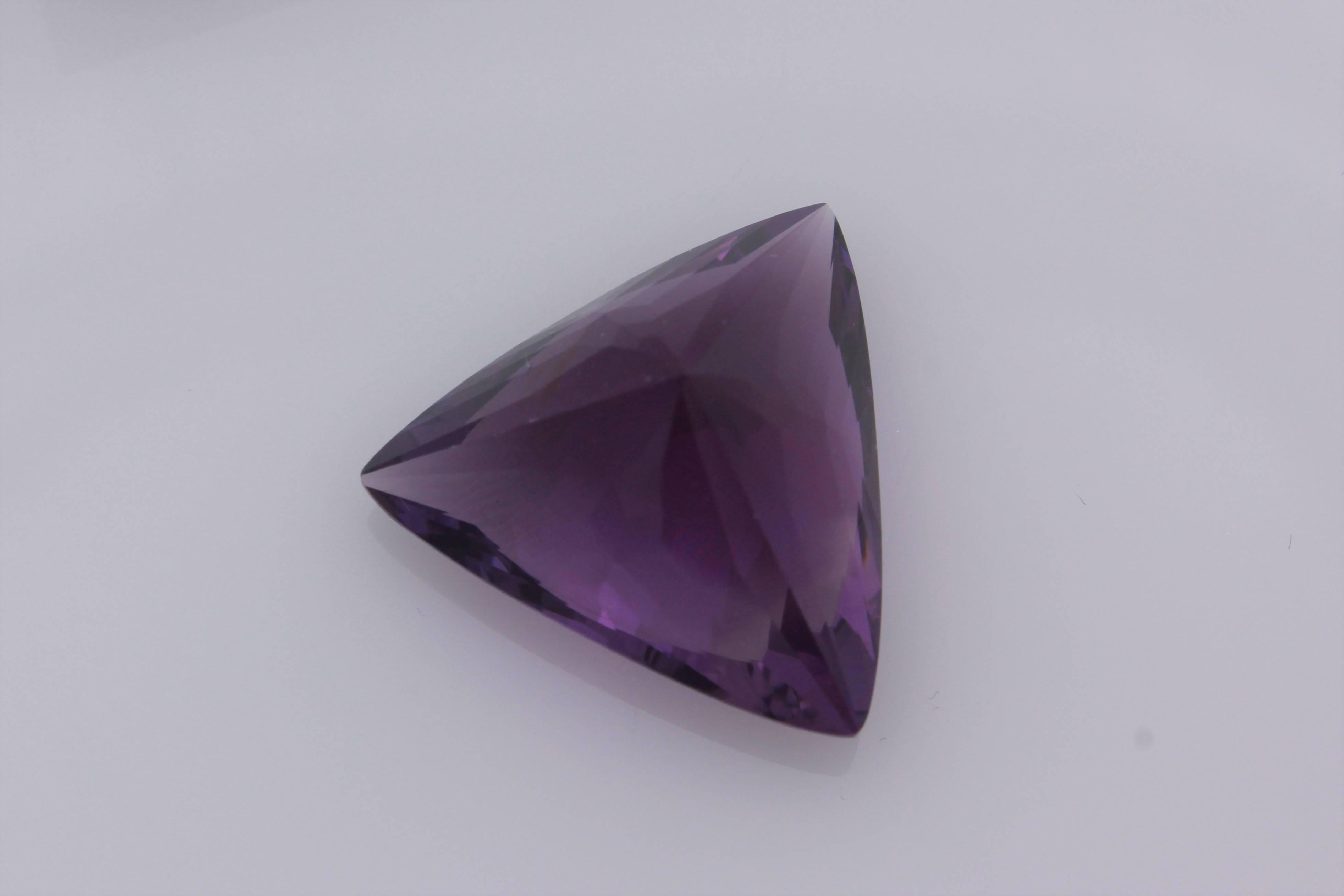 20.17 carat Triangular Shaped Amethyst.  This Amethyst has a deep, rich, royal, purple color and is Pantene's color of the year!  It is excellently cut with tremendous polish and symmetry to bring out the beautiful coloring!  It measures 19.6 mm