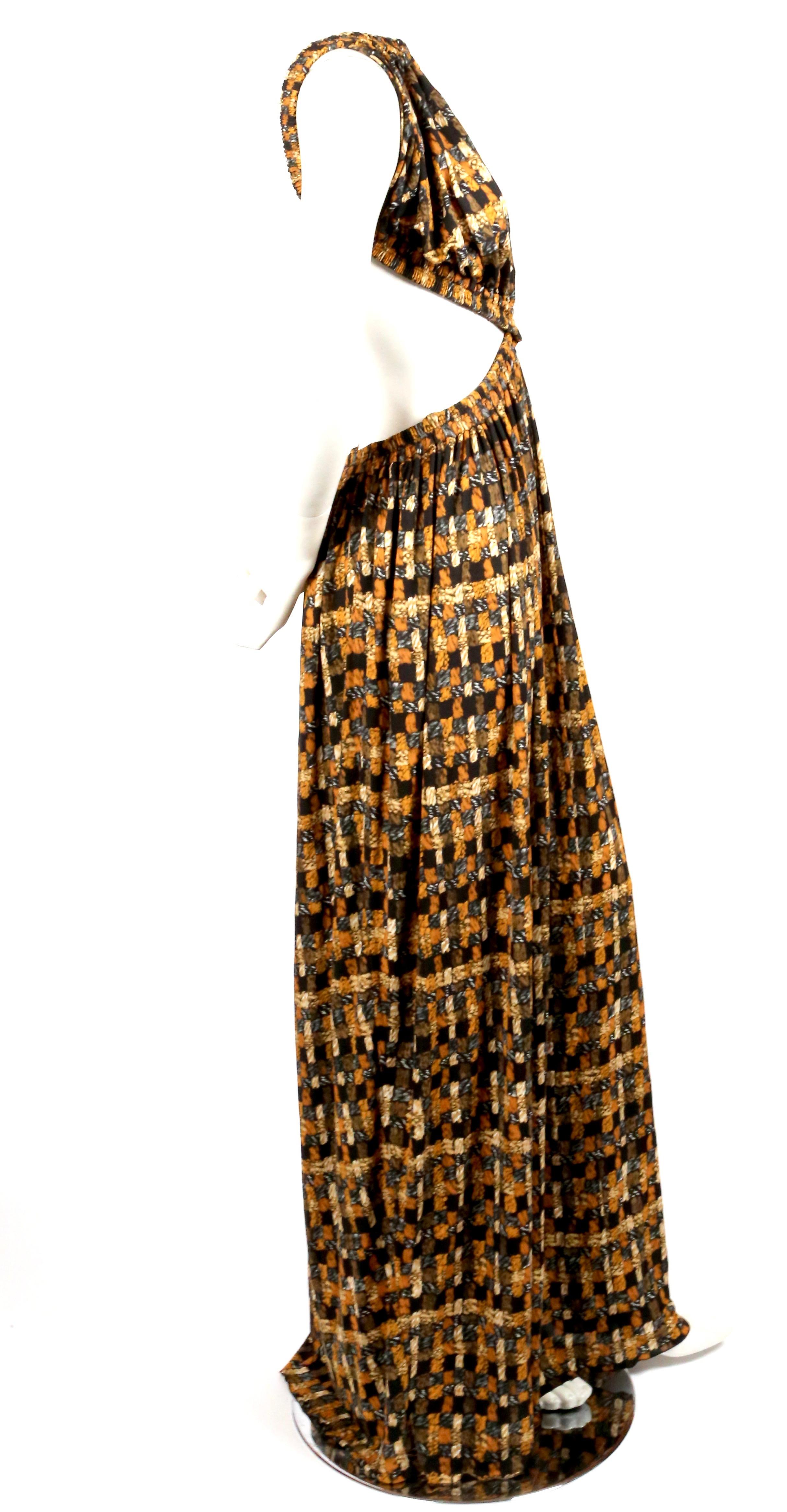 Slinky, basket woven print dress with cut outs designed by Phoebe Philo for Celine exactly as seen on the Spring 2017 runway.  Dress is labeled a French size 40. Measurements are very difficult to take for this piece. It was not clipped through the