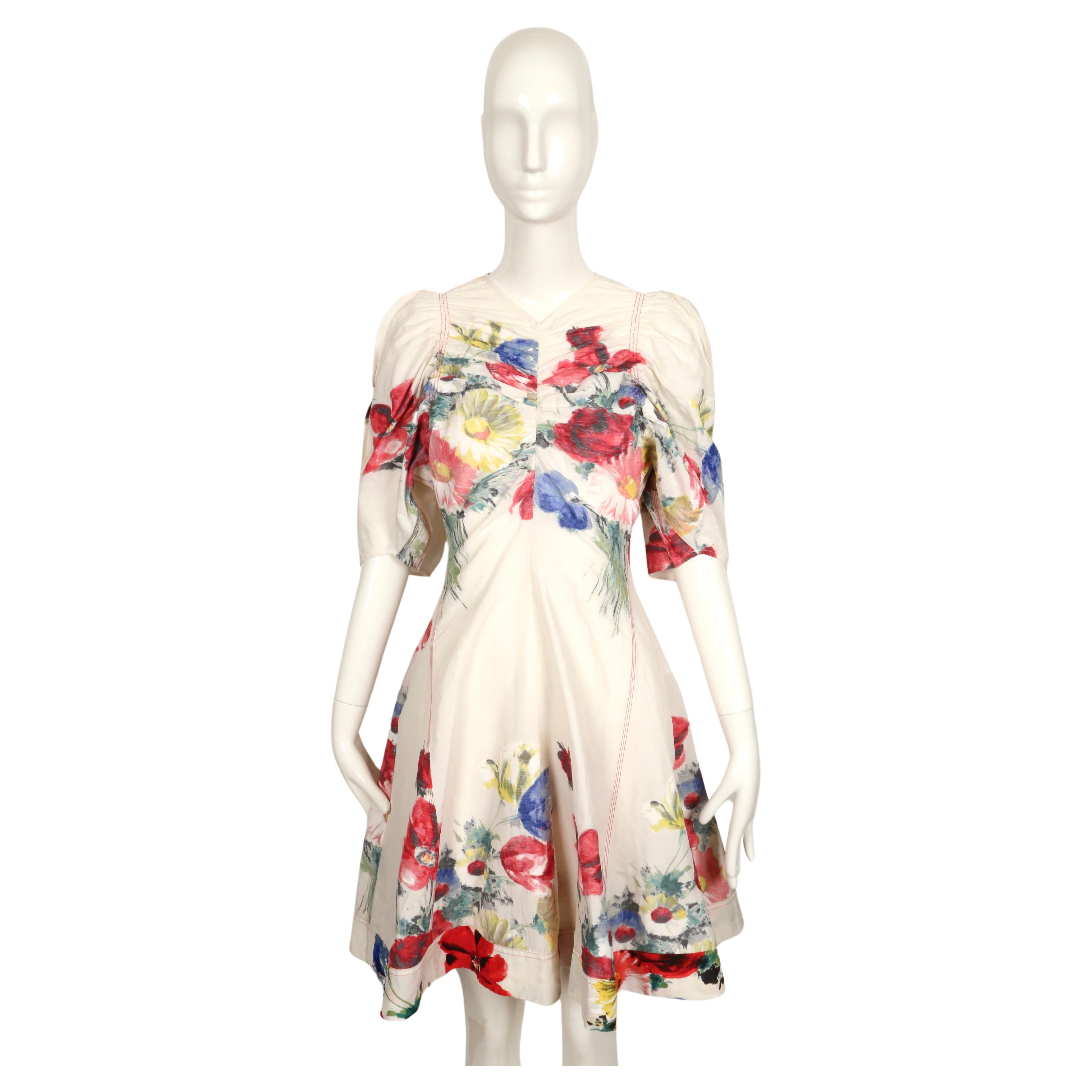 Stunning floral printed jumpsuit romper with ruching and puff sleeves designed by Phoebe Philo for Celine dating to resort of 2017. Similar pieces were seen during the resort 2017 runway/presentation. The exterior fabric of the jumpsuit is actually