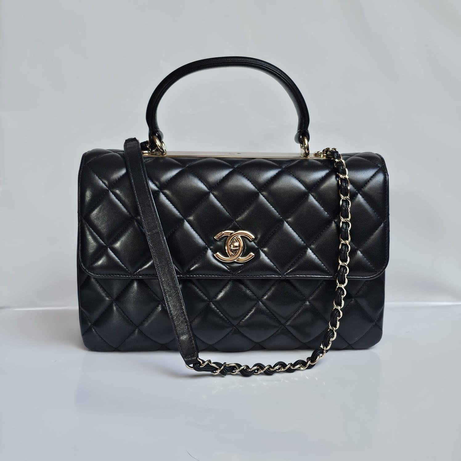Beautiful medium trendy bag in black lambskin with light gold hardware. Overall still in very good condition with light scuffing and scratches on the lambskin surface. Some parts of the hardware are still covered with stickers. Comes with its