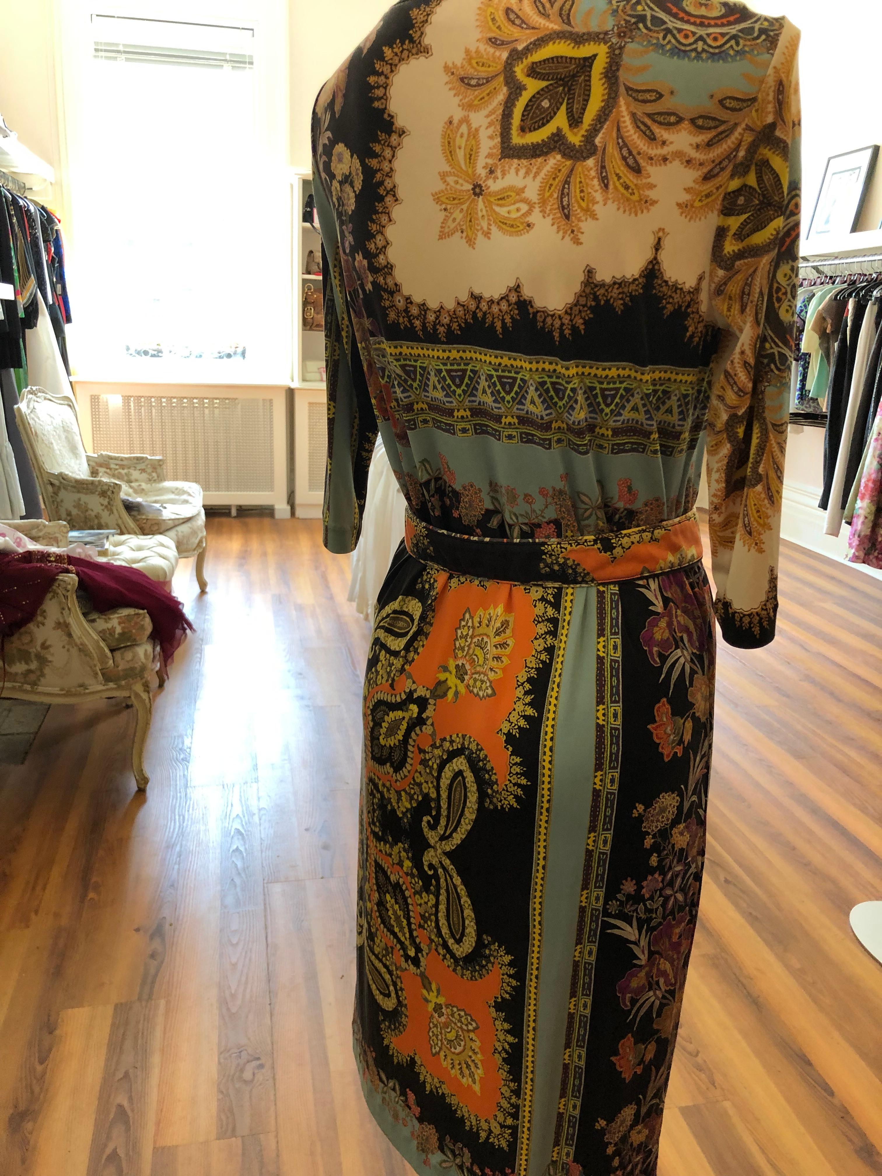 Mixed paisley and floral pattern in brilliant colors, this dress can be worn on its own or with the belt provided. Suitable as a day or cocktail dress.