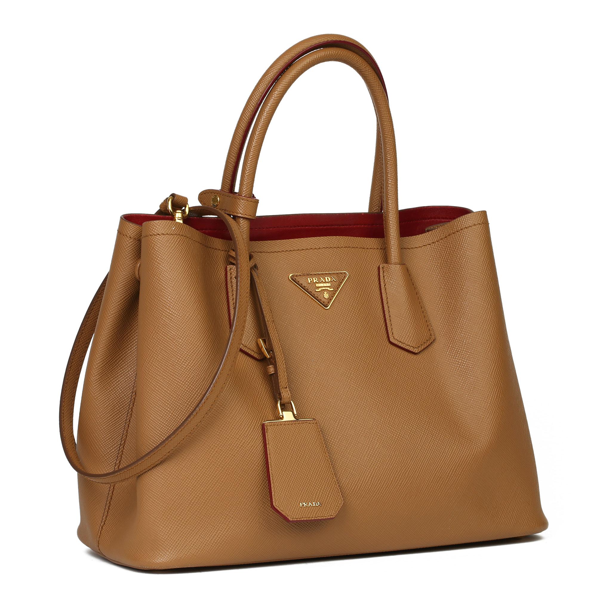 PRADA
Caramel Saffiano Leather Double Tote

Xupes Reference: CB323
Serial Number: 180 A
Age (Circa): 2017
Accompanied By: Prada Dust Bag, Authenticity Card, Handle Keeper, Luggage Tag, Shoulder Strap
Authenticity Details: Serial Stamp (Made in