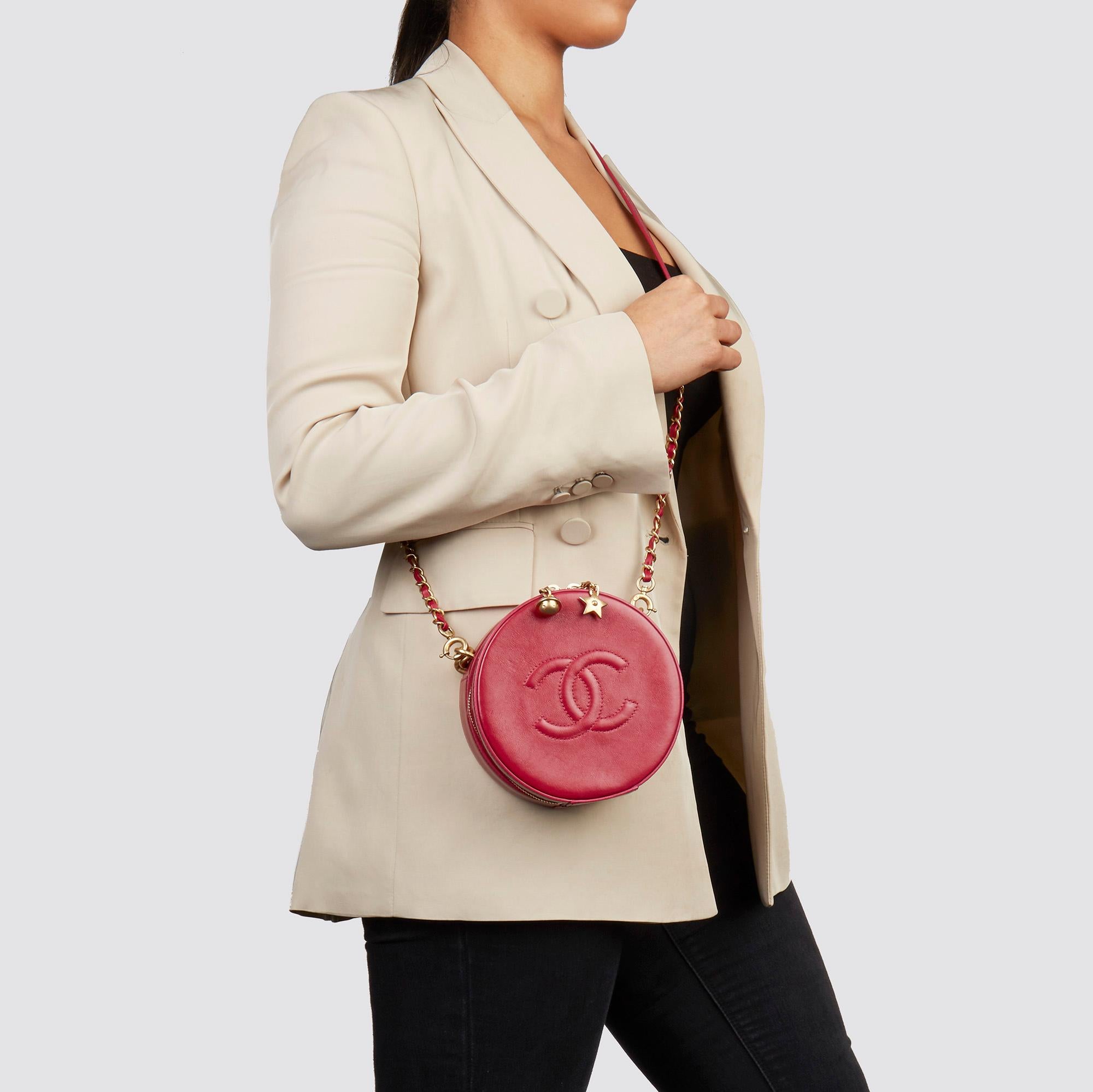 CHANEL 
Raspberry Glazed Calfskin Leather Round as Earth Bag 

Serial Number: 25094584
Age (Circa): 2018
Authenticity Details: Serial Sticker (Made in Italy)
Gender: Ladies
Type: Top Handle, Shoulder, Crossbody 

Colour: Raspberry 
Hardware: