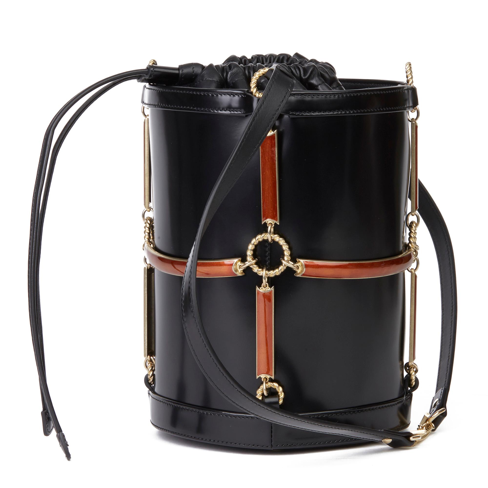 GUCCI
Black Vinyl, Lambskin & Rust Enamel Bucket Bag

Serial Number: 524823525040
Age (Circa): 2018
Accompanied By: Care Booklet
Authenticity Details: Serial Stamp (Made in Italy)
Gender: Ladies
Type: Shoulder

Colour: Black
Hardware:
