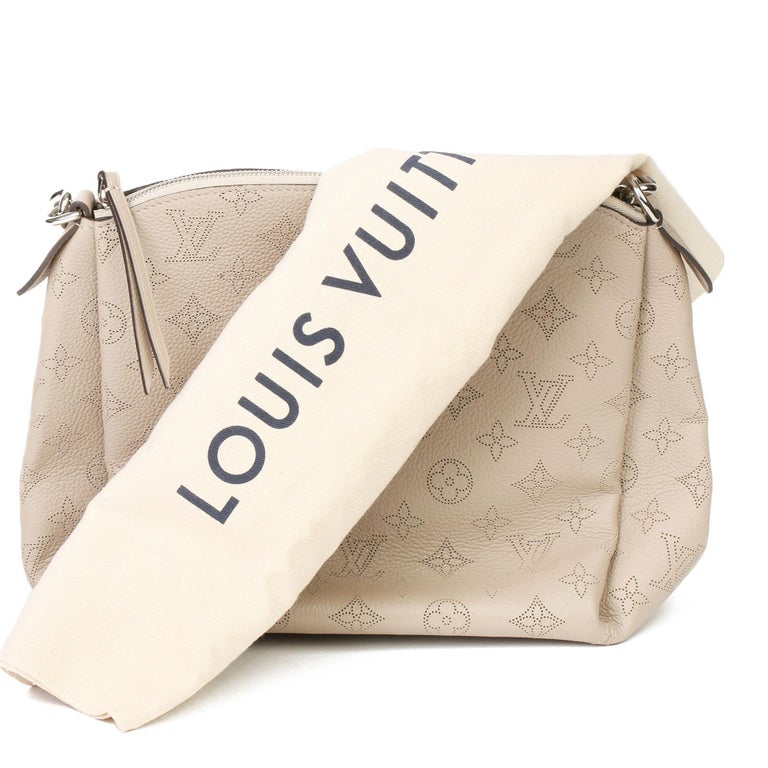 Louis Vuitton Beige Perforated Mahina Leather Babylone MM Galett Handb – On  Que Style