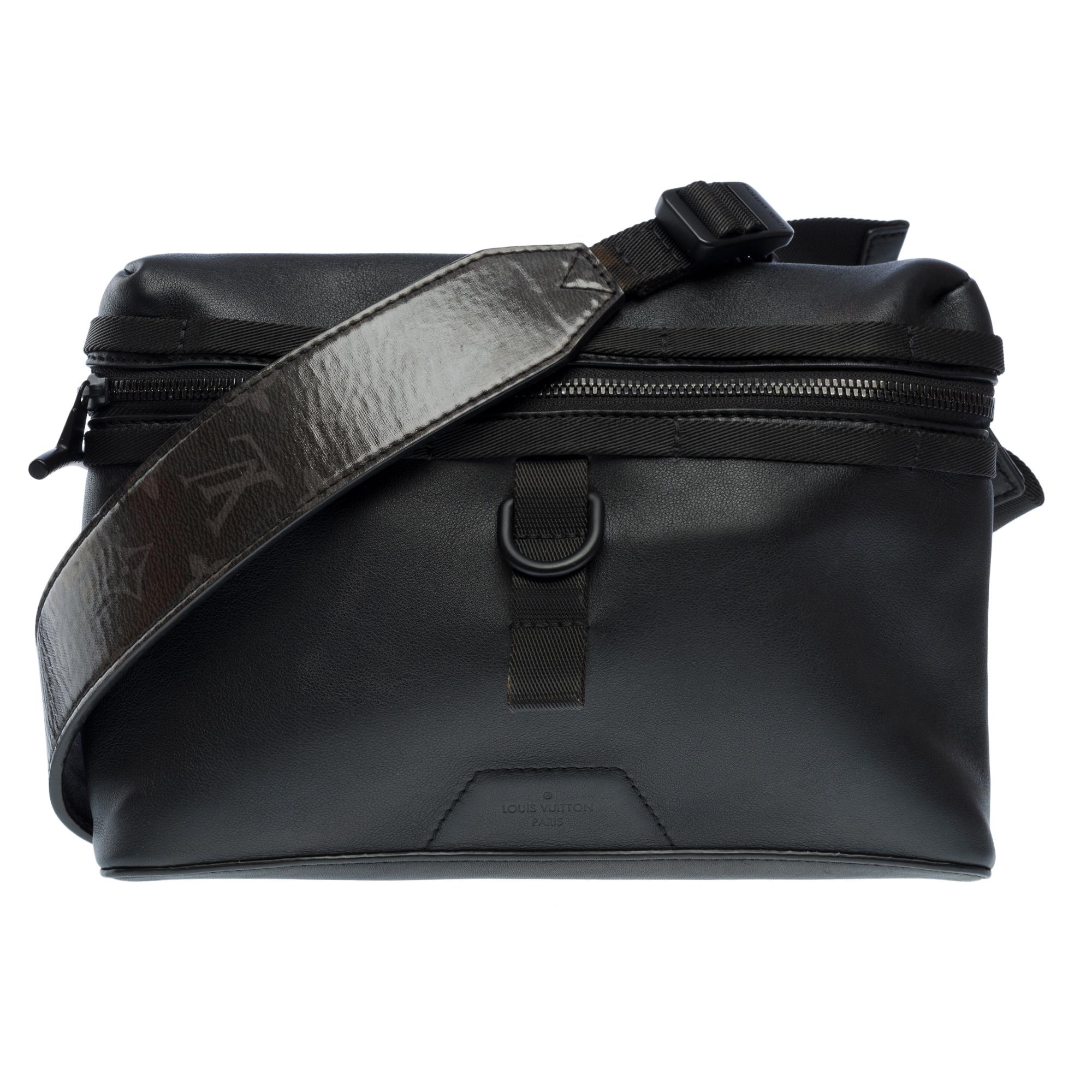 Louis​ ​Vuitton​ ​Messenger​ ​PM​ ​Dark​ ​Infinity​ ​Limited​ ​Edition​ ​Men’s​ ​Fall-Winter​ ​2018​ ​Fashion​ ​Show Crossbody​ ​bag​ ​in​ ​black​ ​calfskin​ ​leather,​ ​blackened​ ​metal​ ​trim,​ ​adjustable​ ​canvas​ ​shoulder​ ​strap​ ​and​