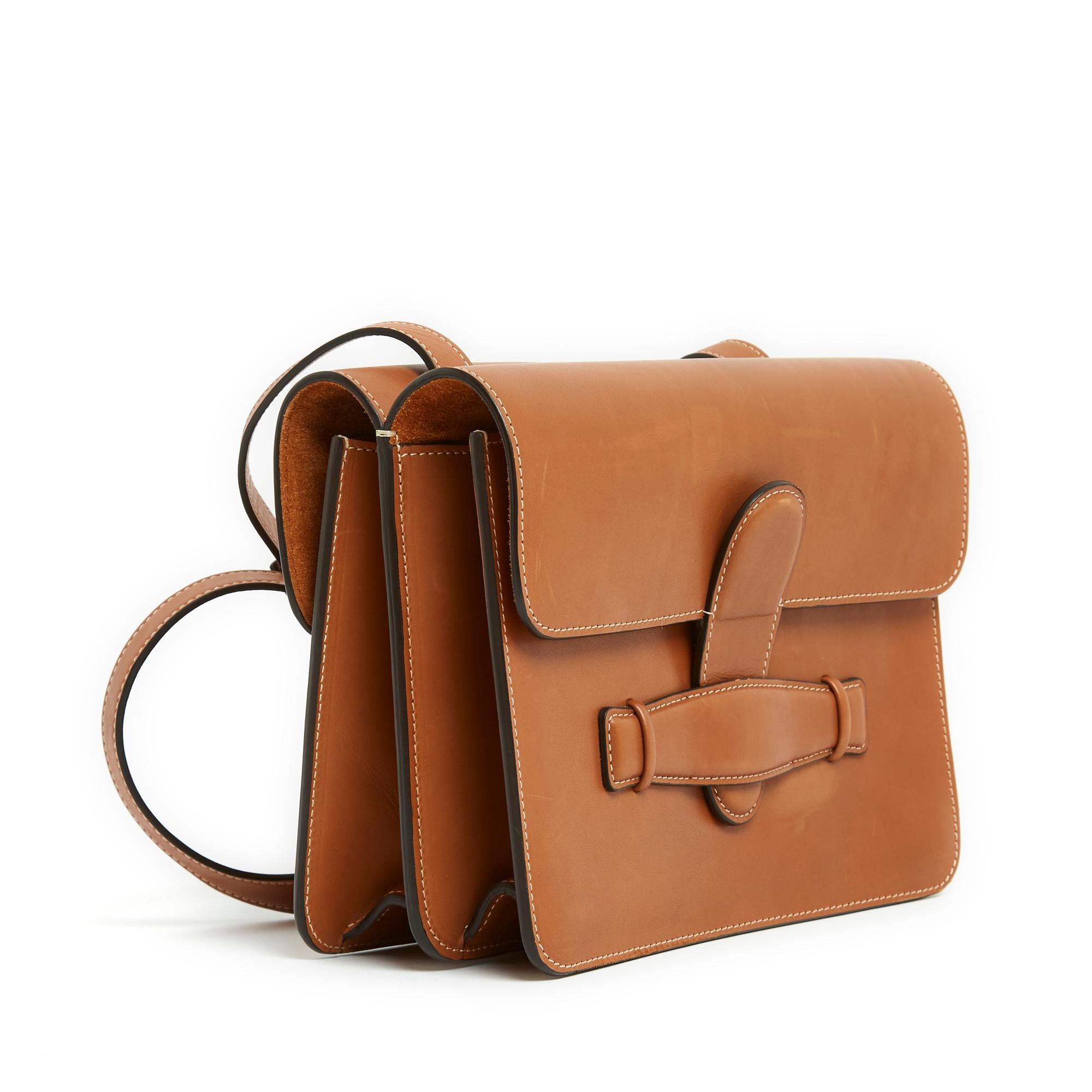Céline bag by Phoebe Philo Symmetrical model in smooth natural or gold or camel colour leather, 1 compartment on each side, lined with matching suede and closed by its flap (with zipped pocket), identical on the other (with double patch pocket),