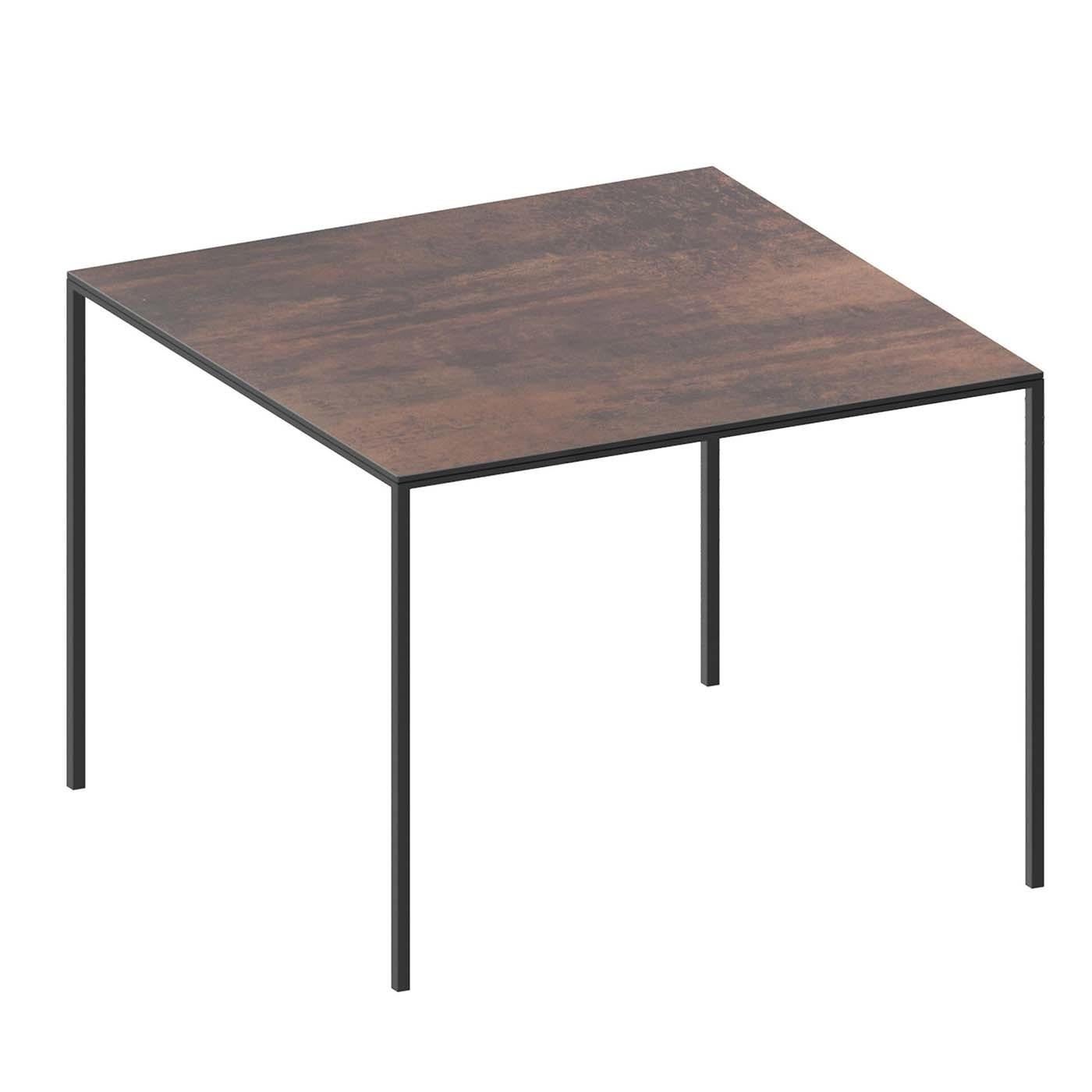 The choice to combine industrial and natural materials is the trademark of all Zeus designs that focus on the raw elegance of each element composing them. This small table features a minimalist square steel tube frame (20 x 30 mm) with four legs in