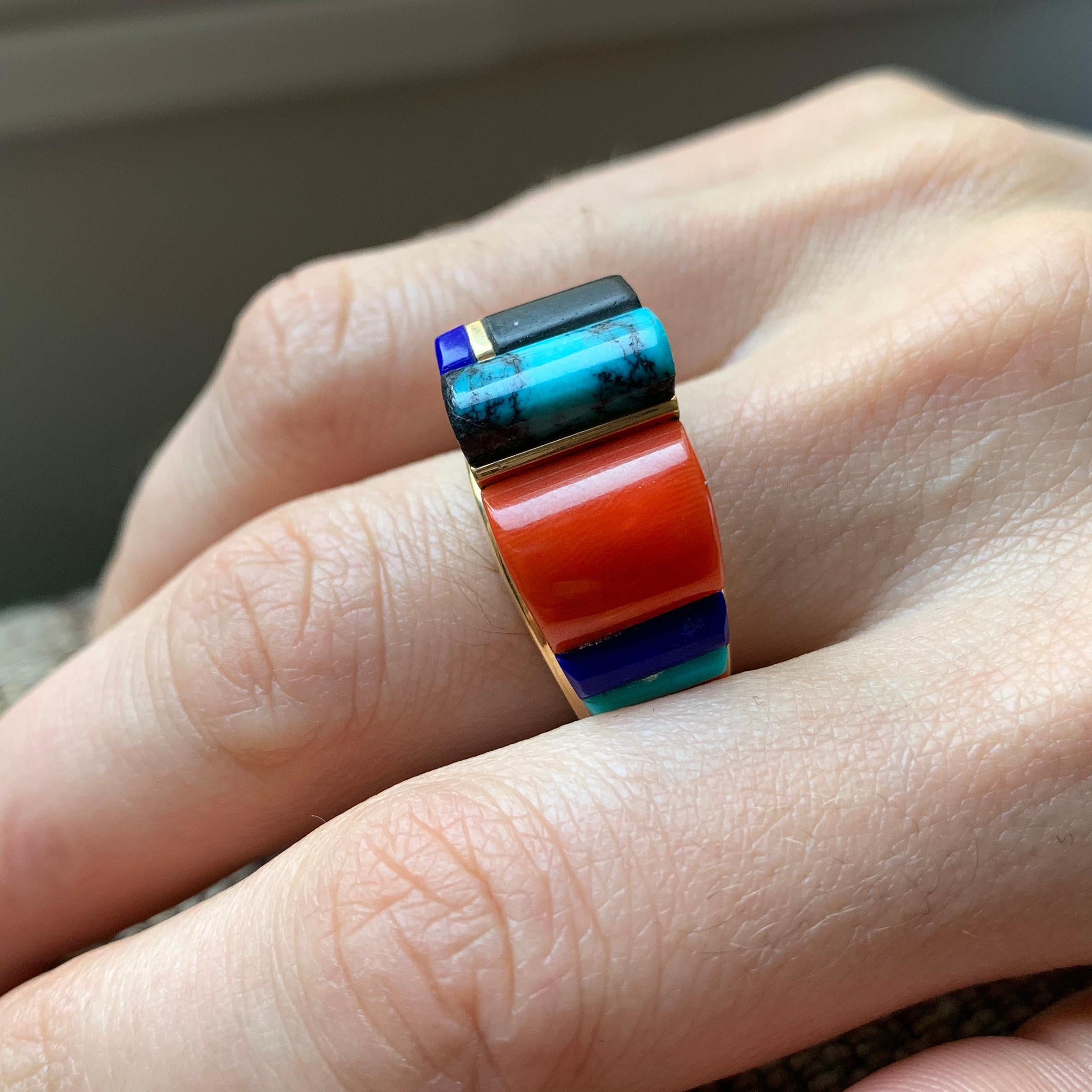This is a coral, lapis lazuli, turquoise, wood and 18 karat gold height inlay ring, by Hopi master jeweler, Verma Nequatewa (Sonwai). The Heard Museum in Phoenix, Arizona launched the first solo retrospective exhibition of her work in 2018 titled