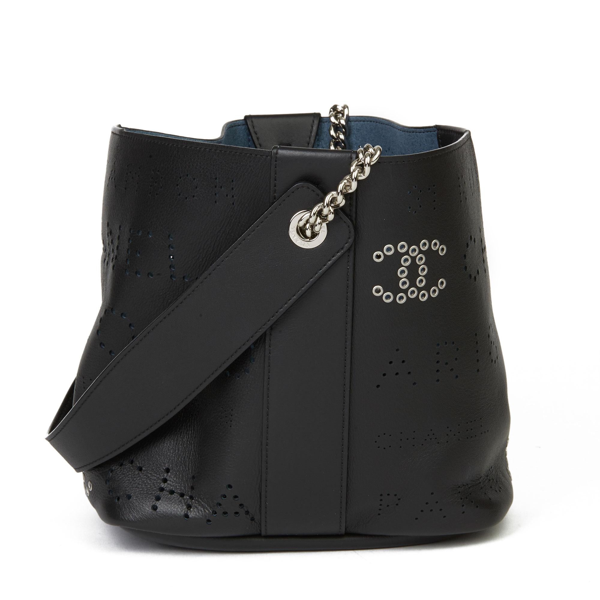 CHANEL
Black Perforated Calfskin Leather Logo Eyelets Bucket Bag with Tweed Pouch

Xupes Reference: HB3634
Serial Number: 27142896
Age (Circa): 2019
Accompanied By: Authenticity Card, Pouch
Authenticity Details: Authenticity Card, Serial Sticker