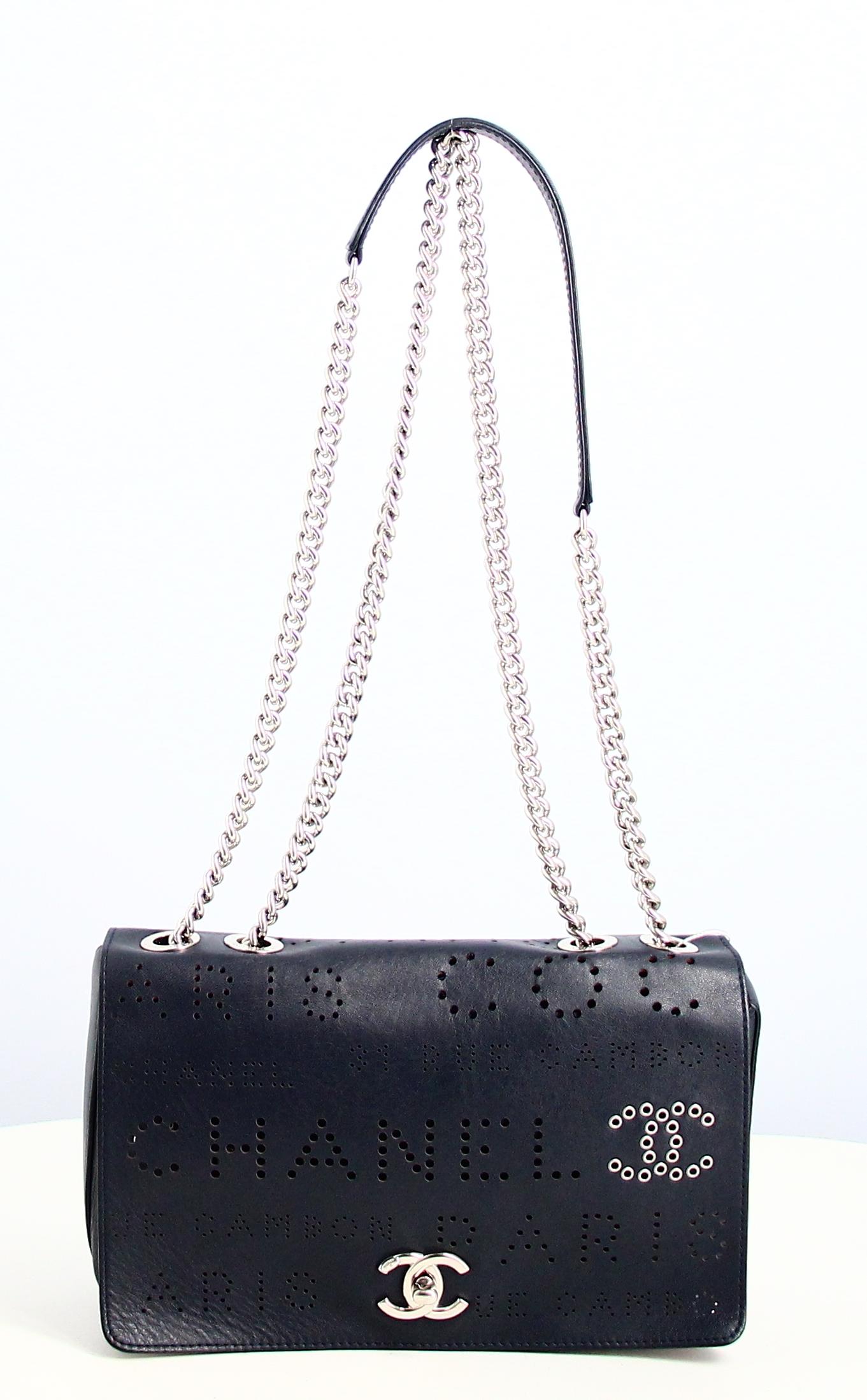 2019 Chanel Eyelet Flap Handbag

- Very good condition. Shows very slight signs of wear over time. 
- Chanel Handbag
- Midnight blue leather 
- Chanel logo 
- Double silver chain in midnight blue leather 
- Interior: pink suede