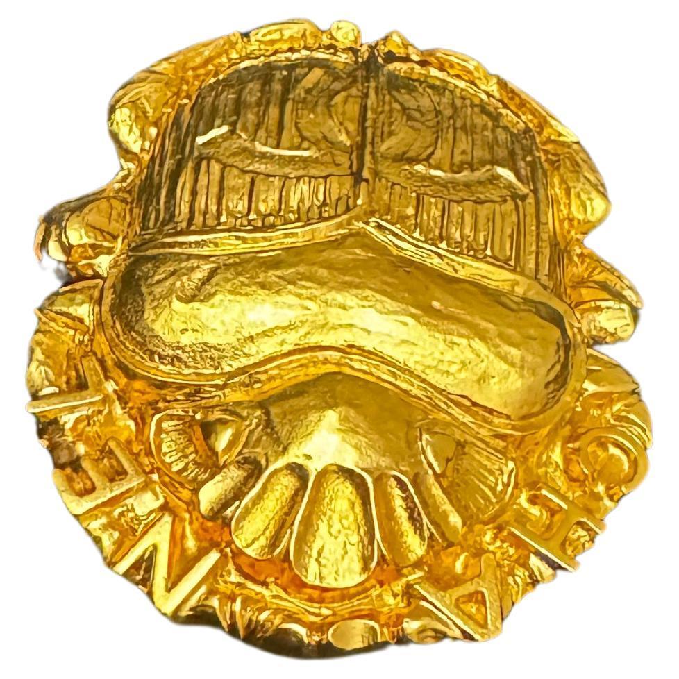 This CHANEL brooch is crafted of gold toned metal sculpted in an Egyptian Scarab Beetle. Stamped CHANEL B 19A made in France. Measures approximately 5.3 x 4.0 cm. Comes with box.

Condition: Like-new condition with minimal to no visible signs of wear
