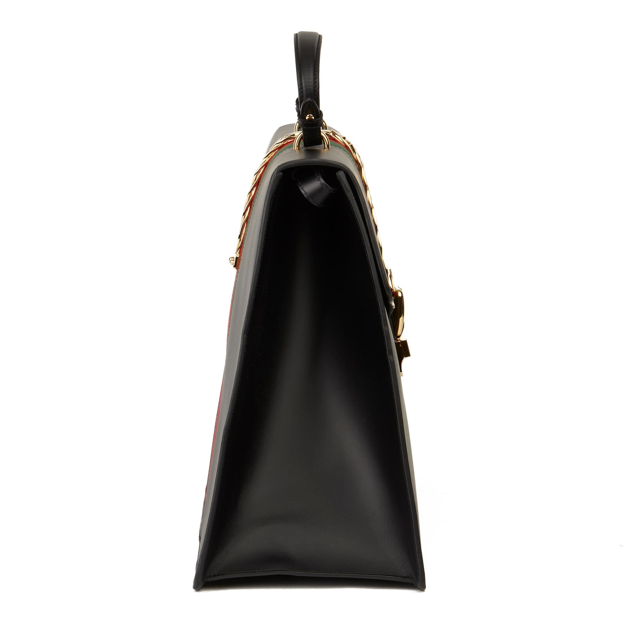 GUCCI
Black Smooth Calfskin Leather Sylvie Top Handle Duffle Bag 

Xupes Reference: HB3176
Serial Number: 485468 204991
Age (Circa): 2019
Accompanied By: Gucci Dust Bag, Care Booklet, Leather Swatch, Tag
Authenticity Details: Serial Stamp (Made in