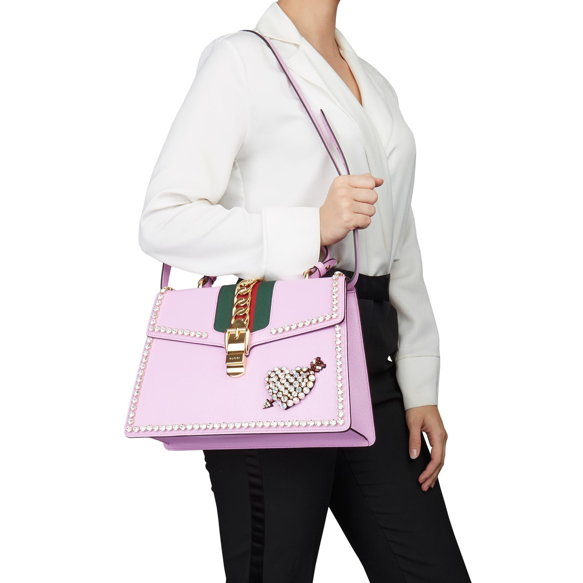 GUCCI
Pink Pigskin Leather Crystallised Medium Sylvie Top Handle 

Xupes Reference: HB3085
Serial Number: 431665 527066
Age (Circa): 2019
Accompanied By: Gucci Dust Bag, Care Booklet, Leather Swatch, Shoulder Strap
Authenticity Details: Serial Stamp