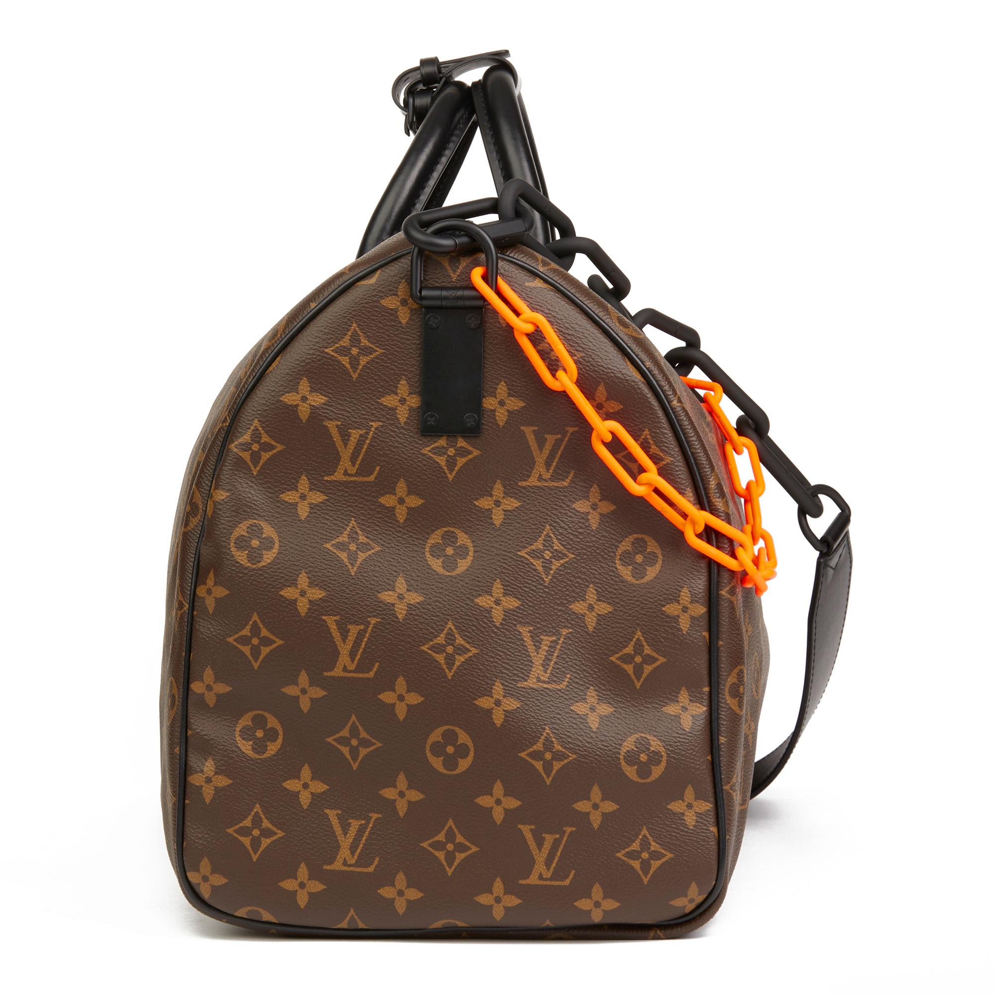 LOUIS VUITTON
Brown Monogram Coated Canvas & Black Calfskin Leather Virgil Abloh Keepall Bandouliere 50

Reference: HB2826
Serial Number: AA0189
Age (Circa): 2019
Accompanied By: Louis Vuitton Dust Bag, Box, Padlock, Keys, Shoulder Strap, Luggage