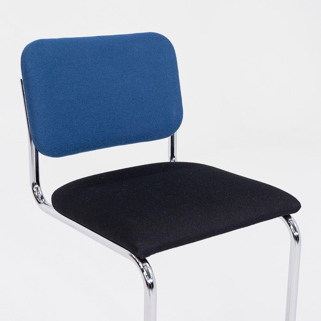 These are Cesca Bar Stools, originally designed by Marcel Breuer in 1928. These particular examples were produced by Knoll in 2019. The stools are comprised of a tubular steel frame with a seat and back upholstered in fabric. The listed price